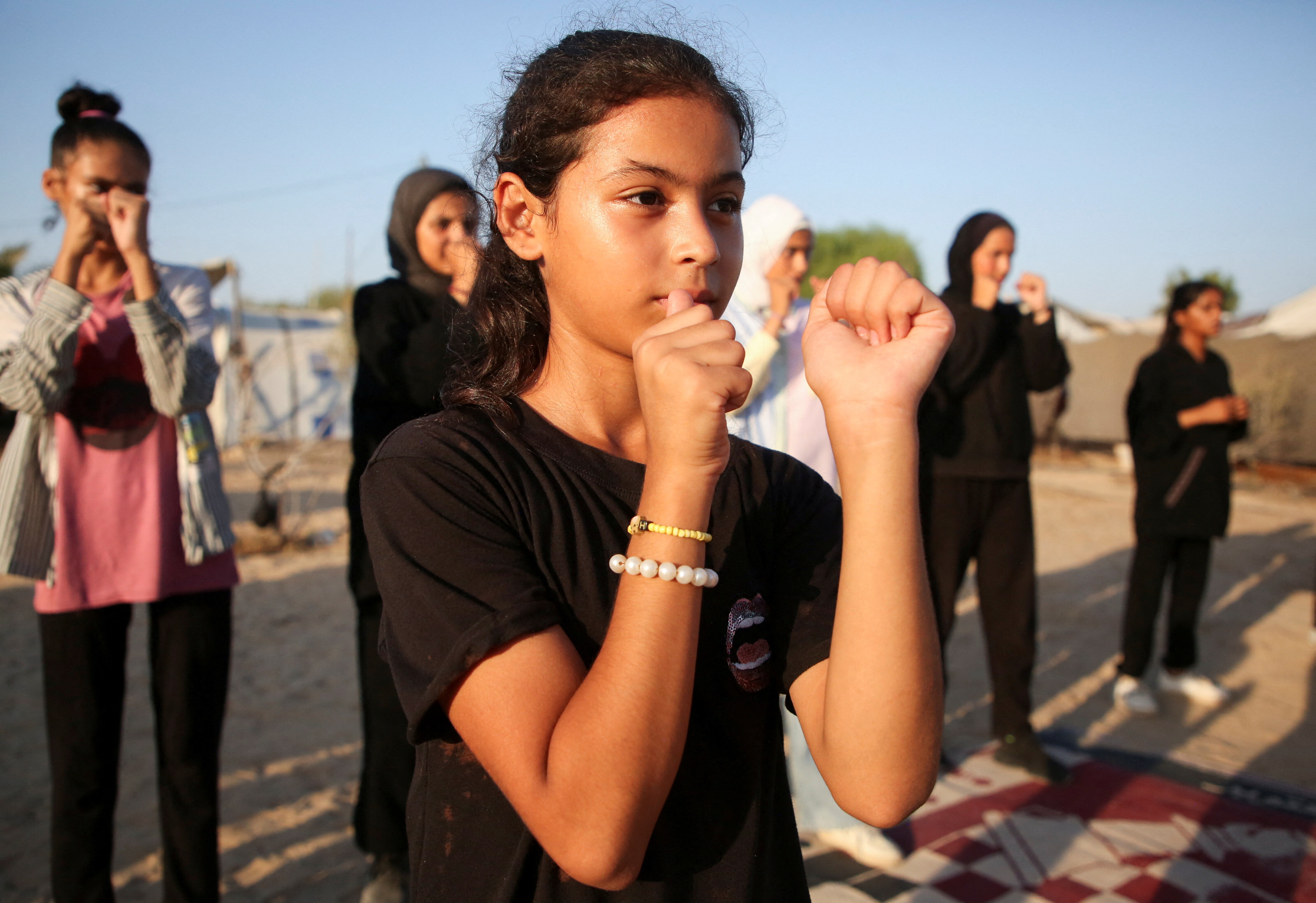 As bombs shatter Gaza, boxing coach emboldens girls