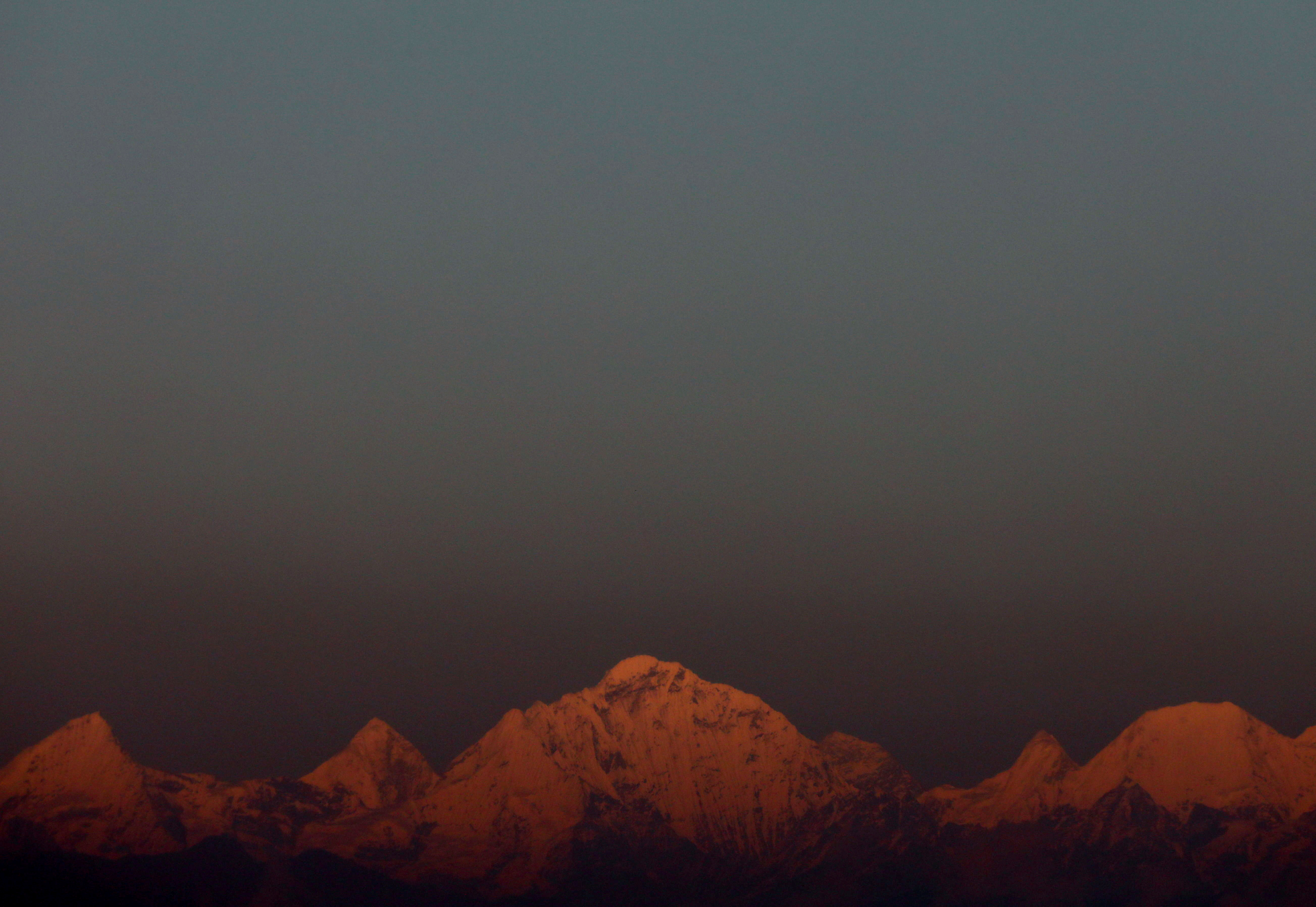 Mount Everest, the world's highest mountain, and other peaks of the Himalayan range are seen during sunset from Kathmandu
