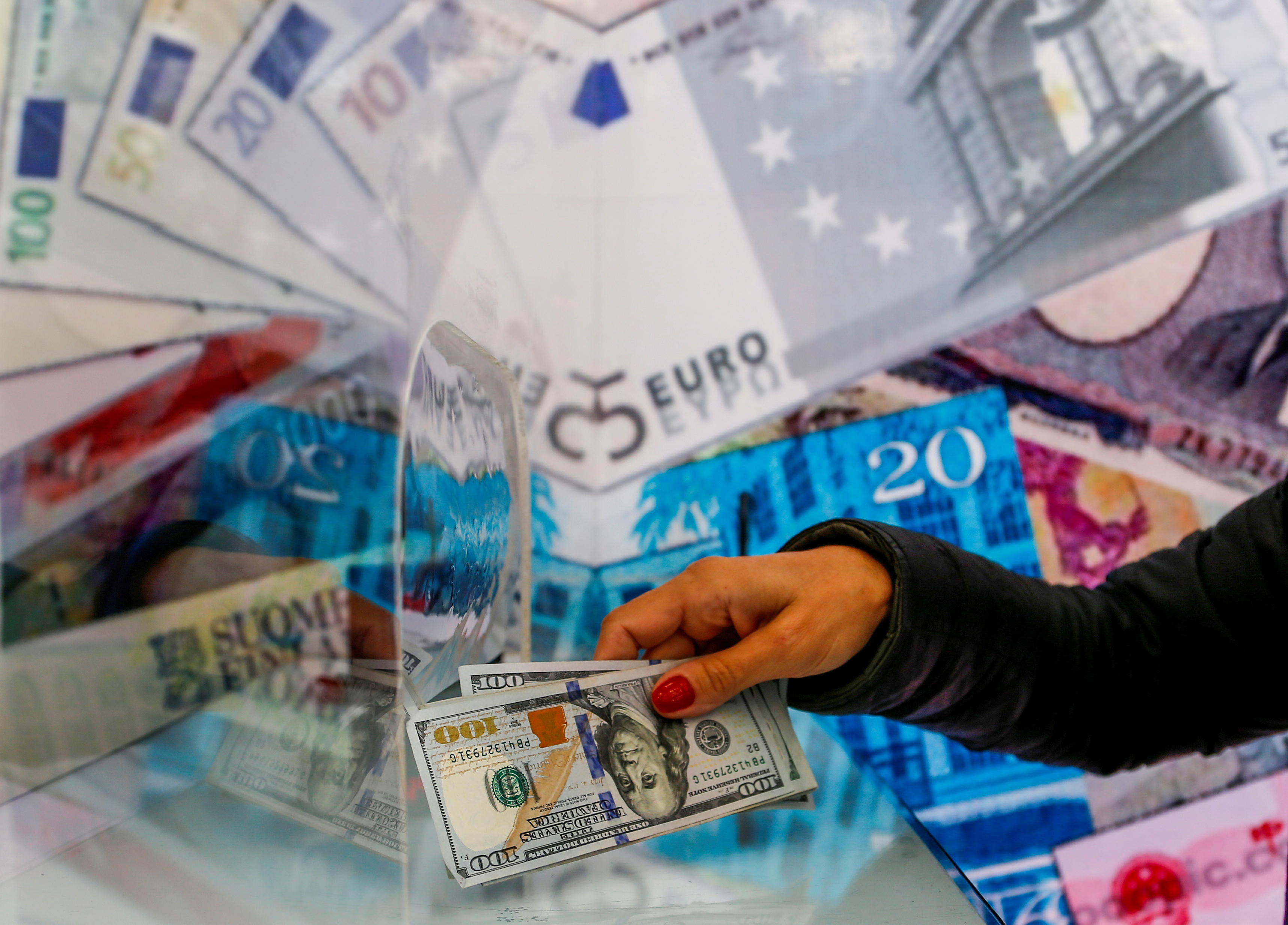 FILE PHOTO: A money changer sells U.S. dollar bills in Ankara