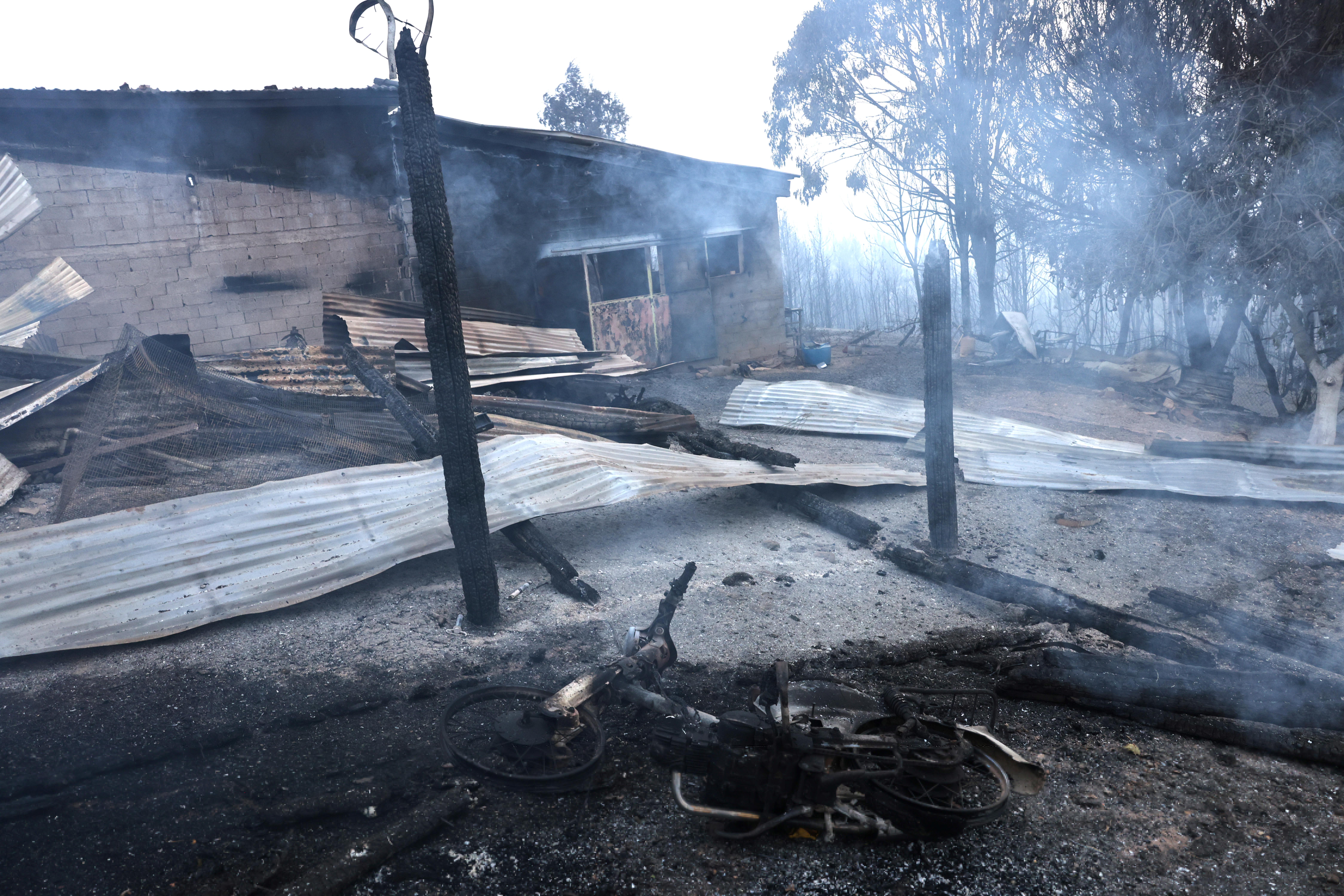 A damaged farm is seen following a wildfire in the village of Lasdikas near ancient Olympia, Greece, August 6, 2021. REUTERS/Giorgos Moutafis