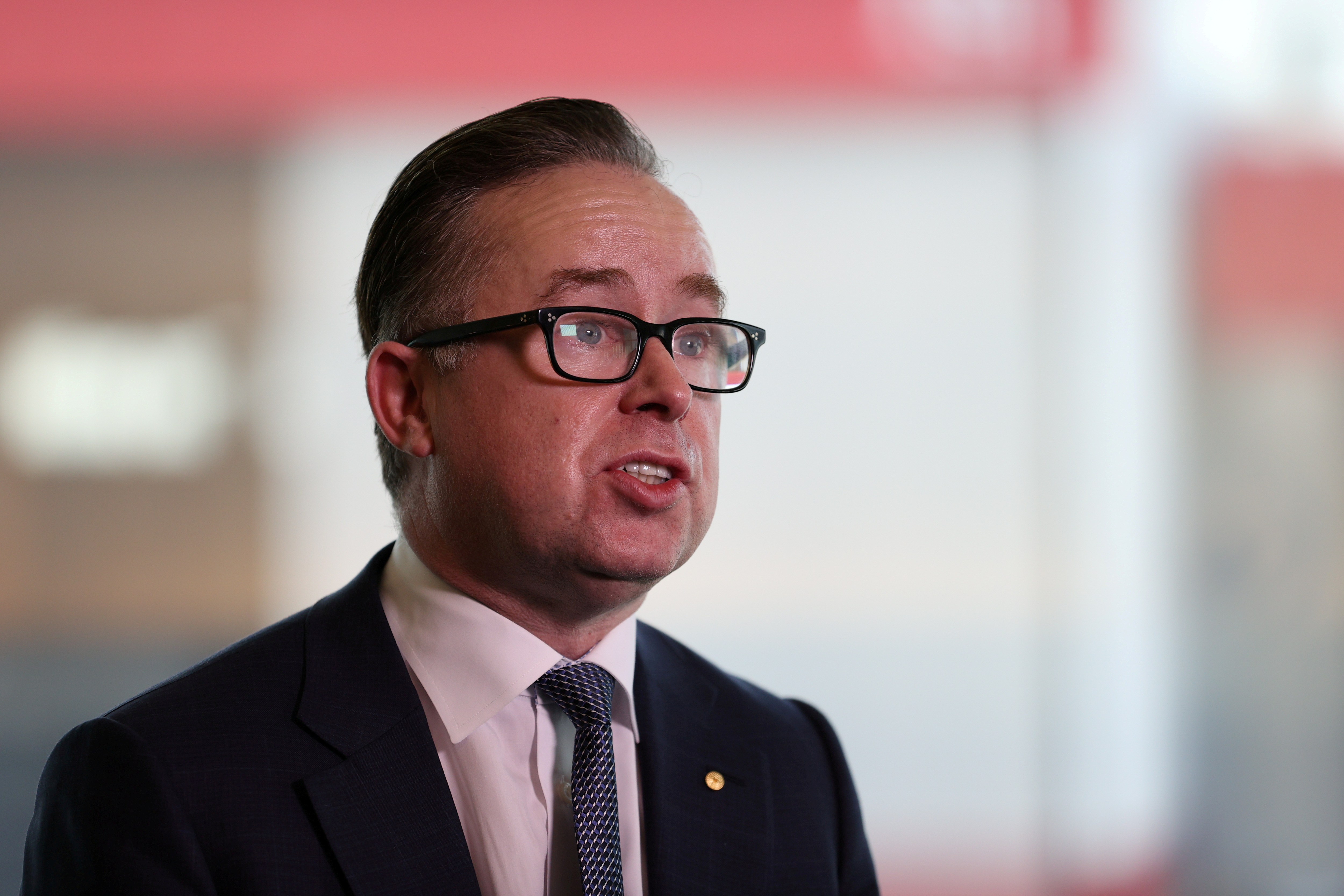 Qantas' CEO speaks with members of the media at an event in Sydney