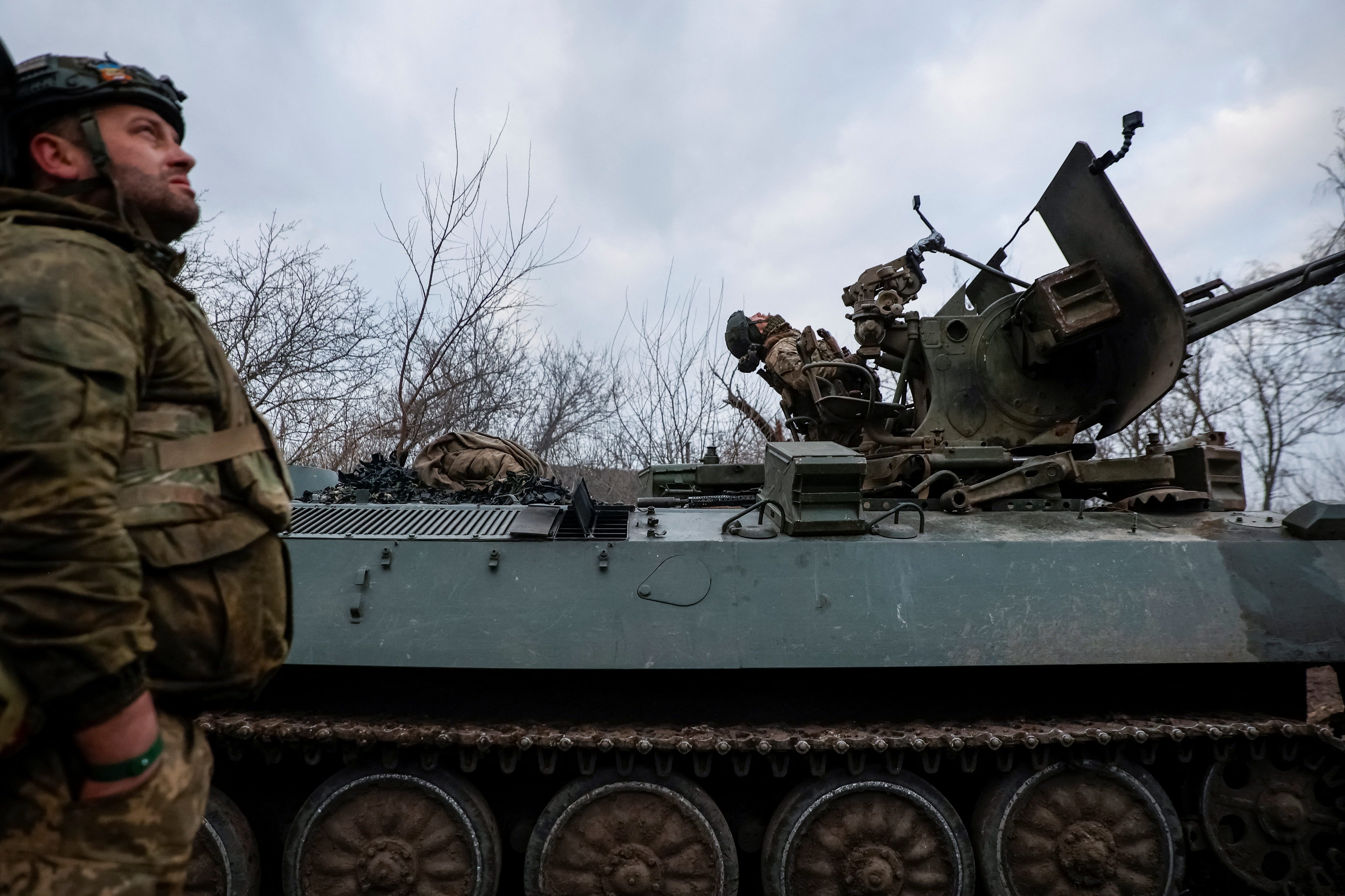 Ukrainian servicemen from air defence unit monitor a sky at a frontline near the town of Bakhmut
