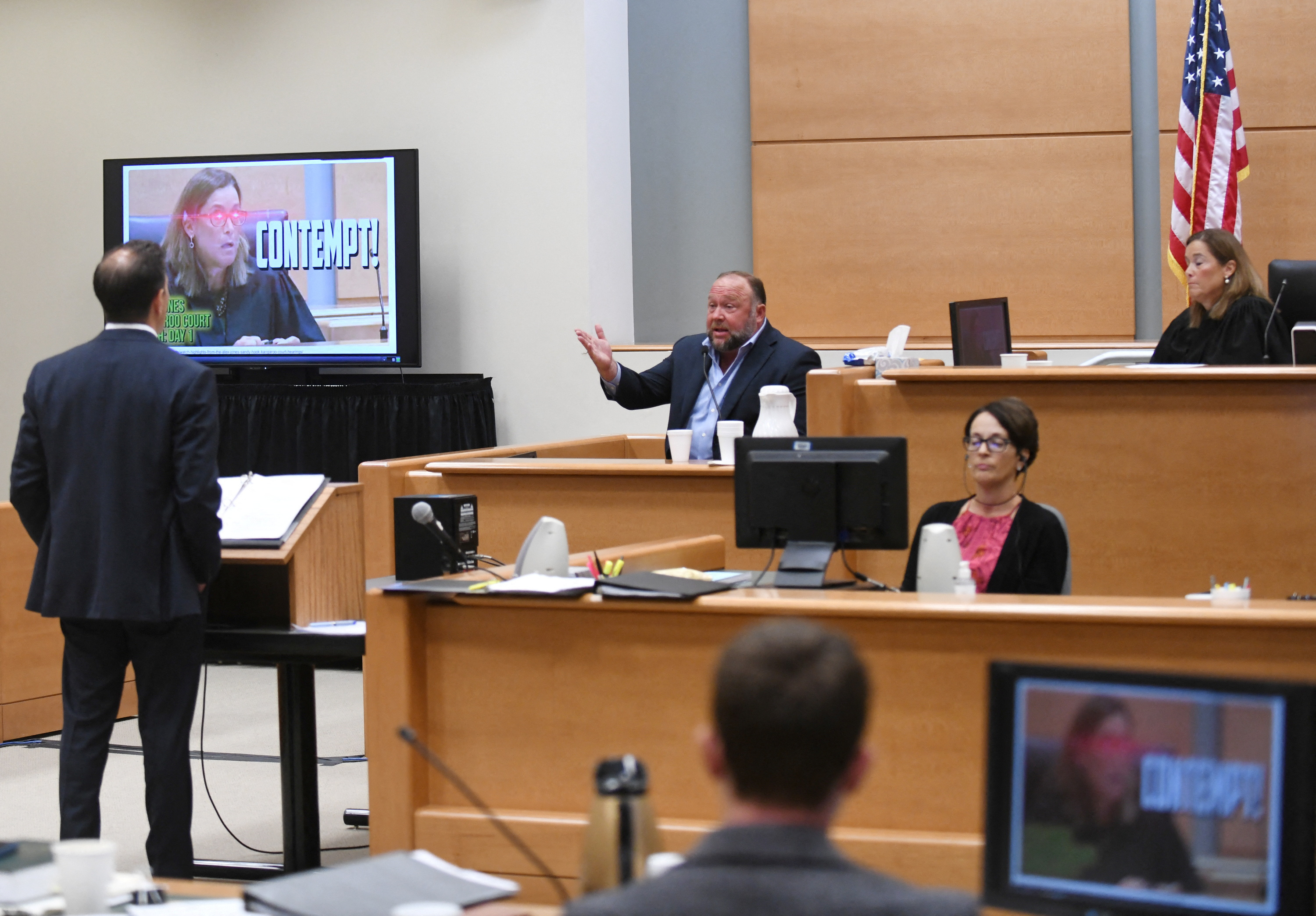 Infowars founder Alex Jones takes the witness stand to testify