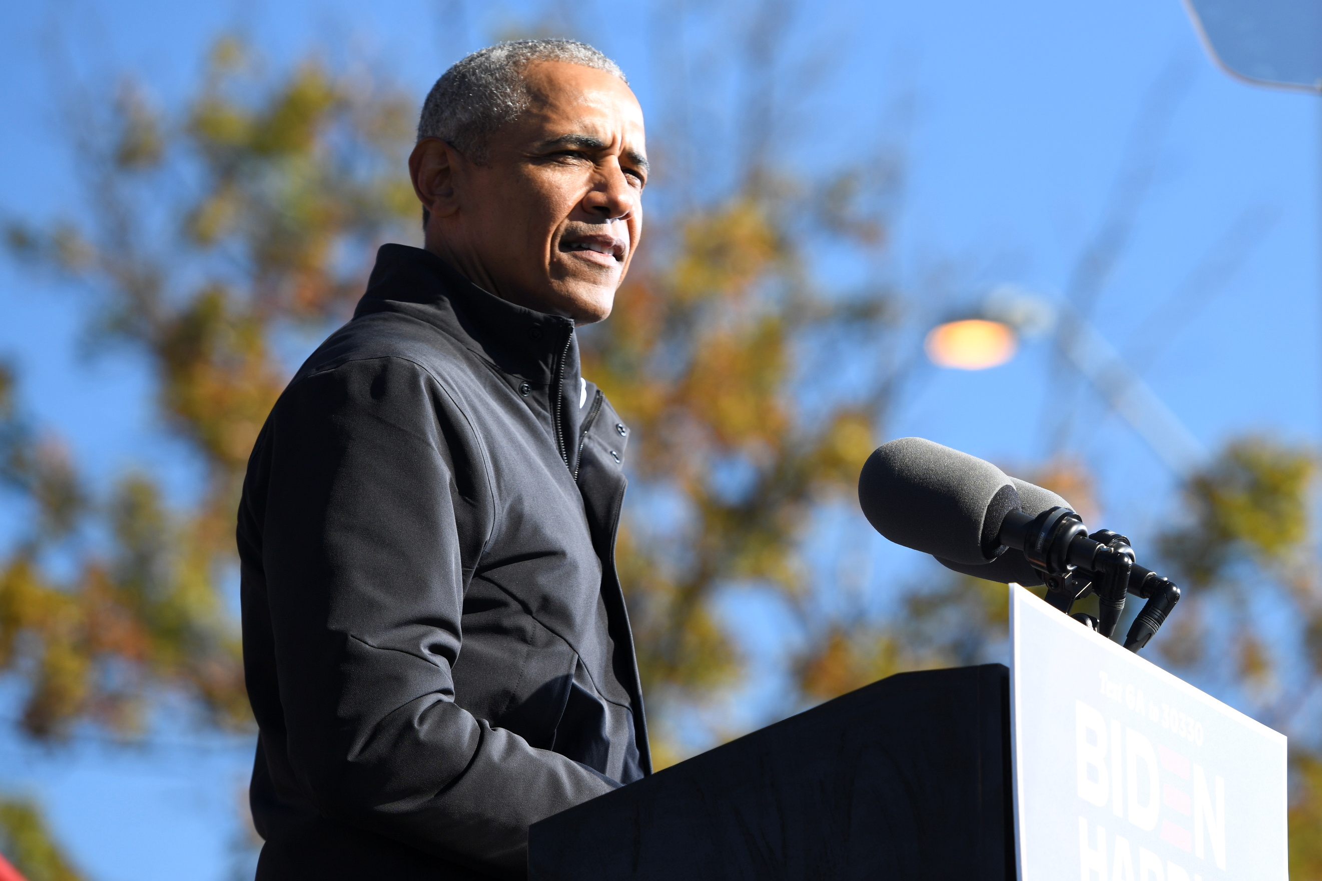 Former President Barack Obama addresses voters one day before the election, in Atlanta, Georgia