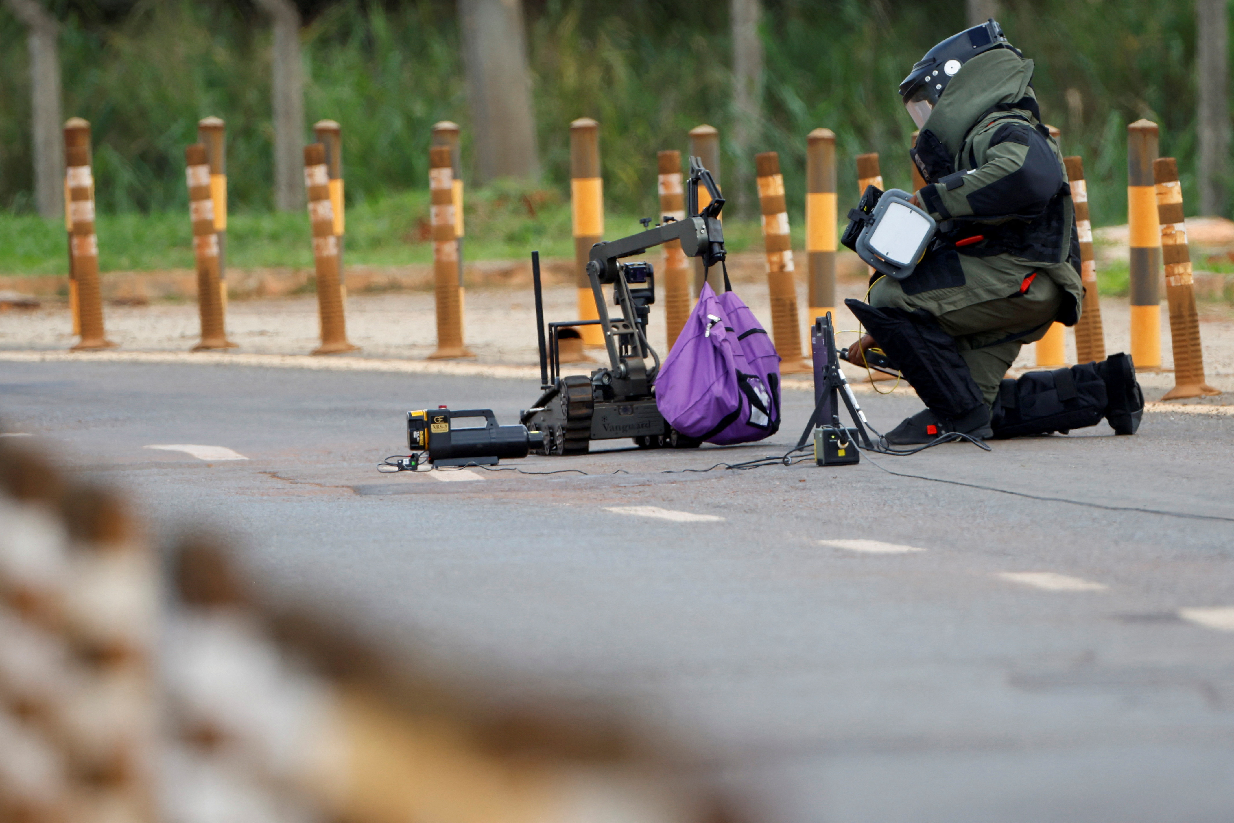 A member of the anti-bomb group of the Federal police work in Brasilia