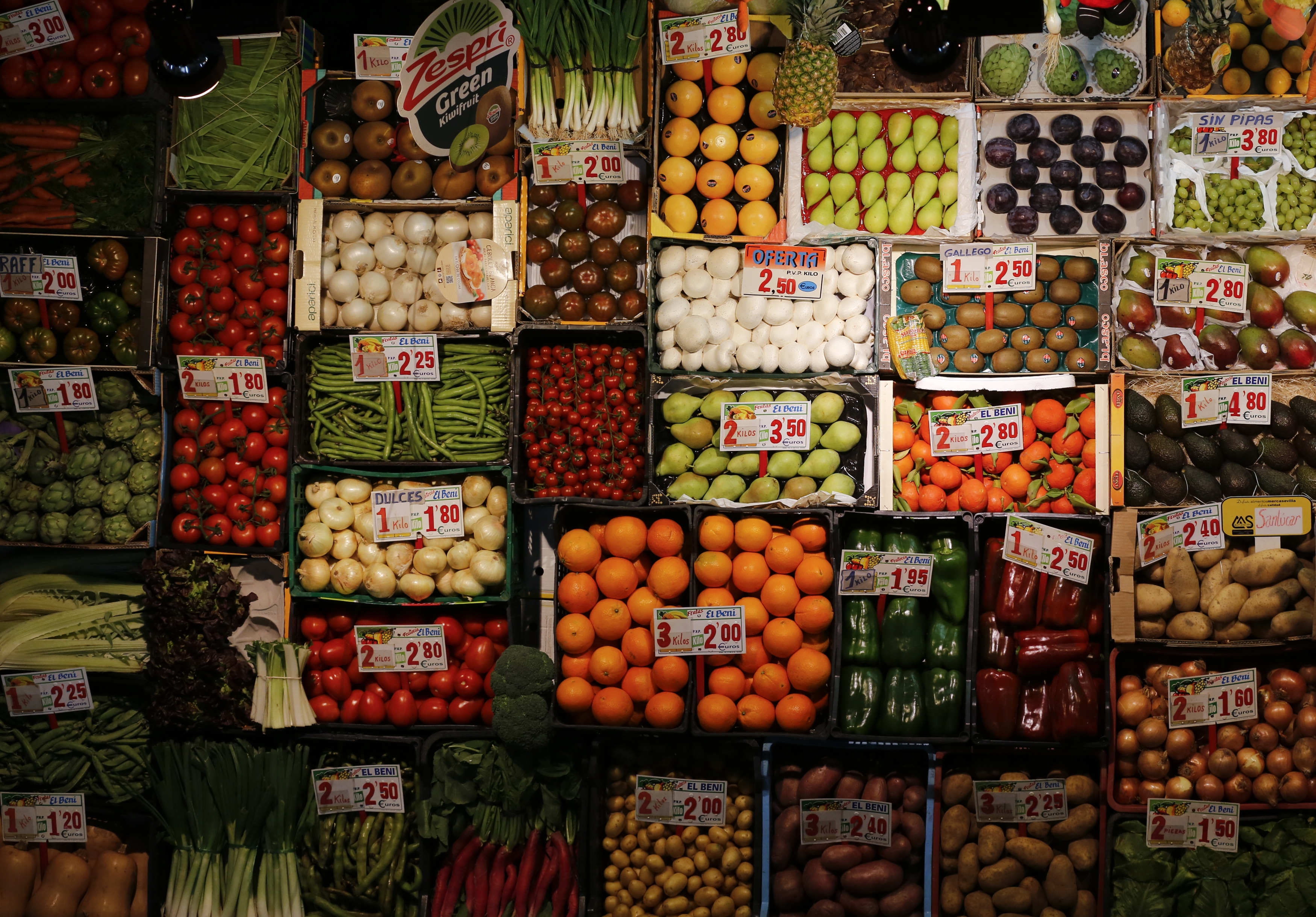 Fruits and vegetables are displayed to be sell at a shop of a food market in the Andalusian capital of Seville, southern Spain