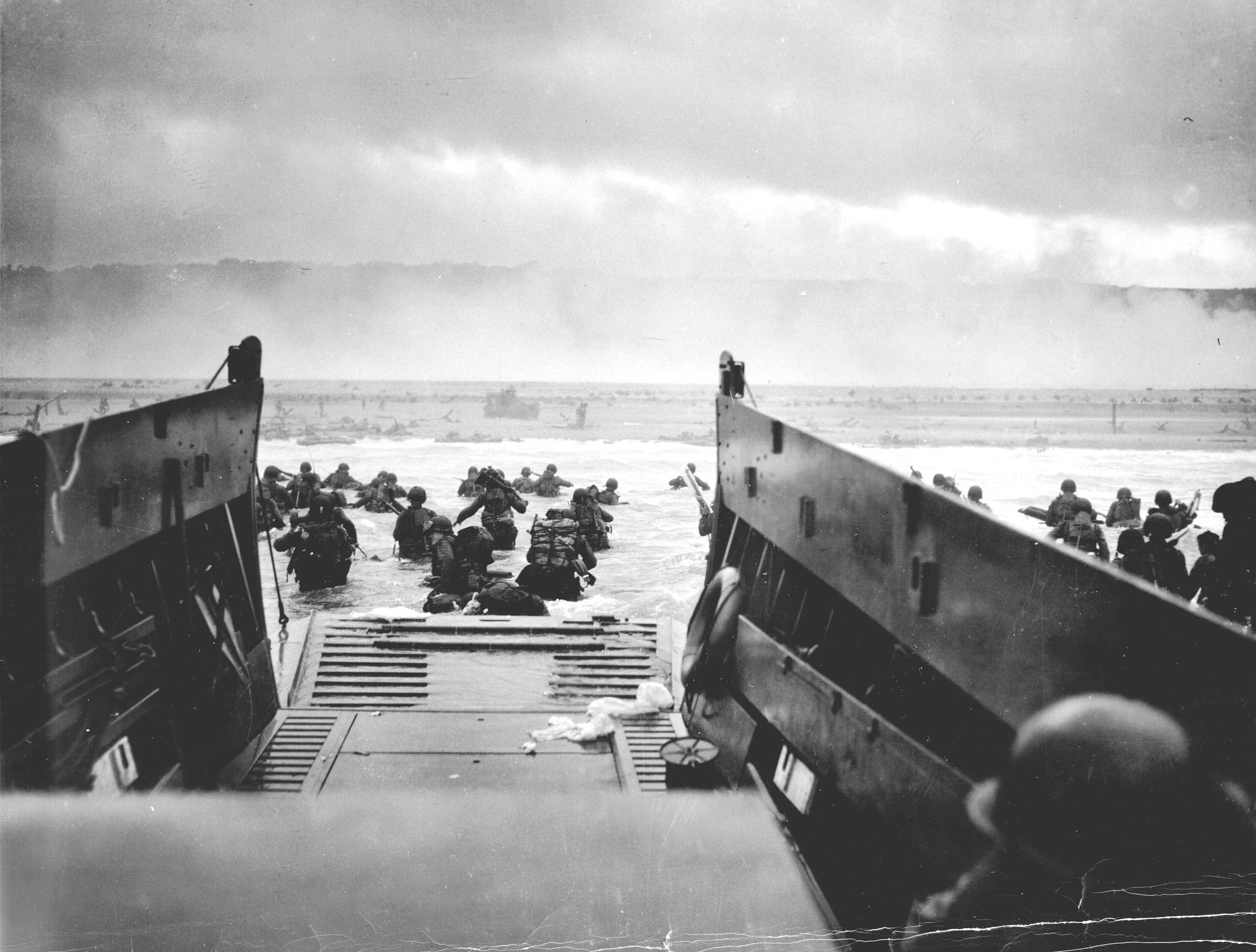 Handout photo of U.S. troops wading ashore from a Coast Guard landing craft at Omaha Beach during the Normandy D-Day landings near Vierville sur Mer