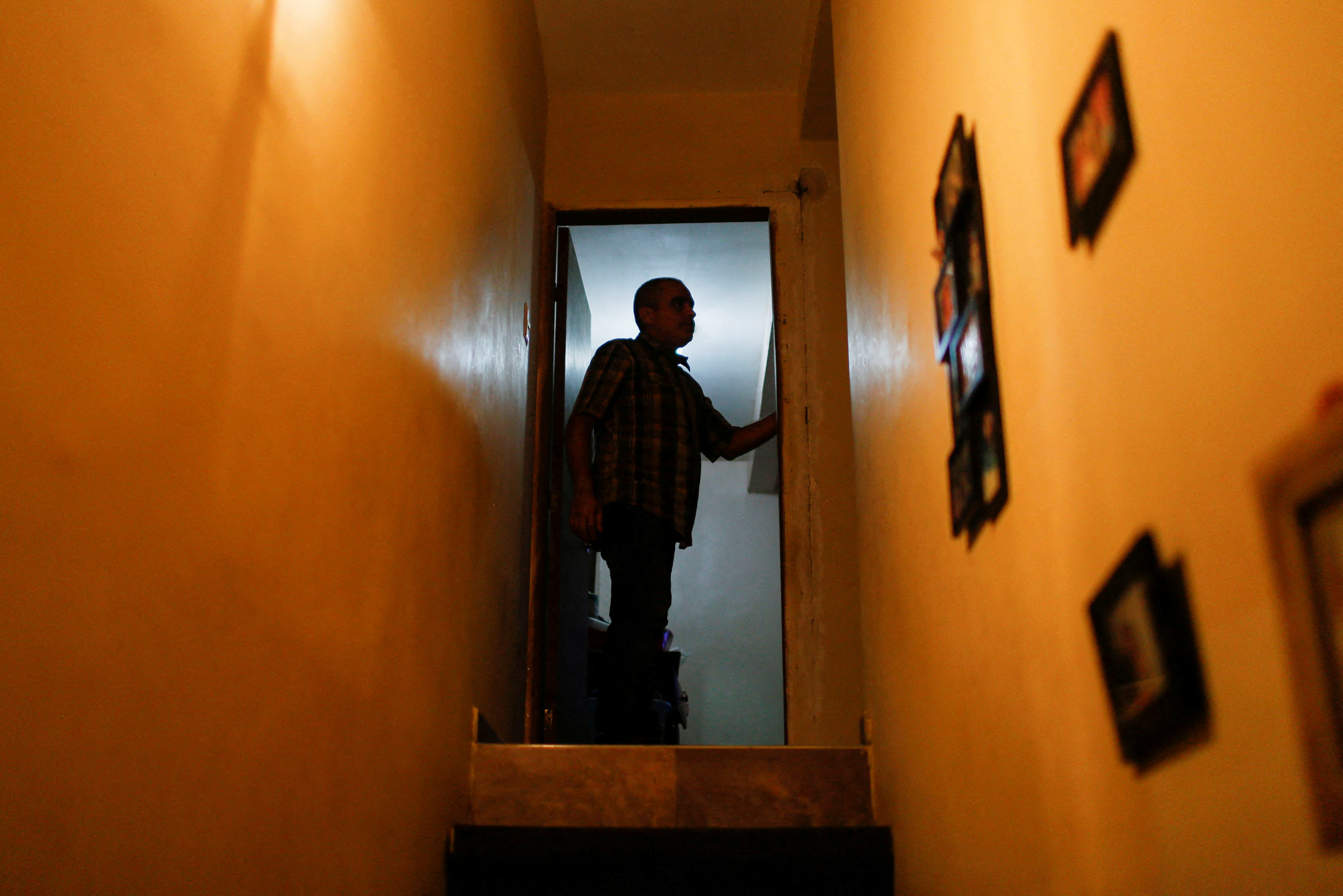 Anibal Pirela prepares in his home days before immigrating with his four-year-old son to join his wife and daughter in the United States, in Maracaibo, Venezuela November 30, 2021. REUTERS/Leonardo Fernandez Viloria