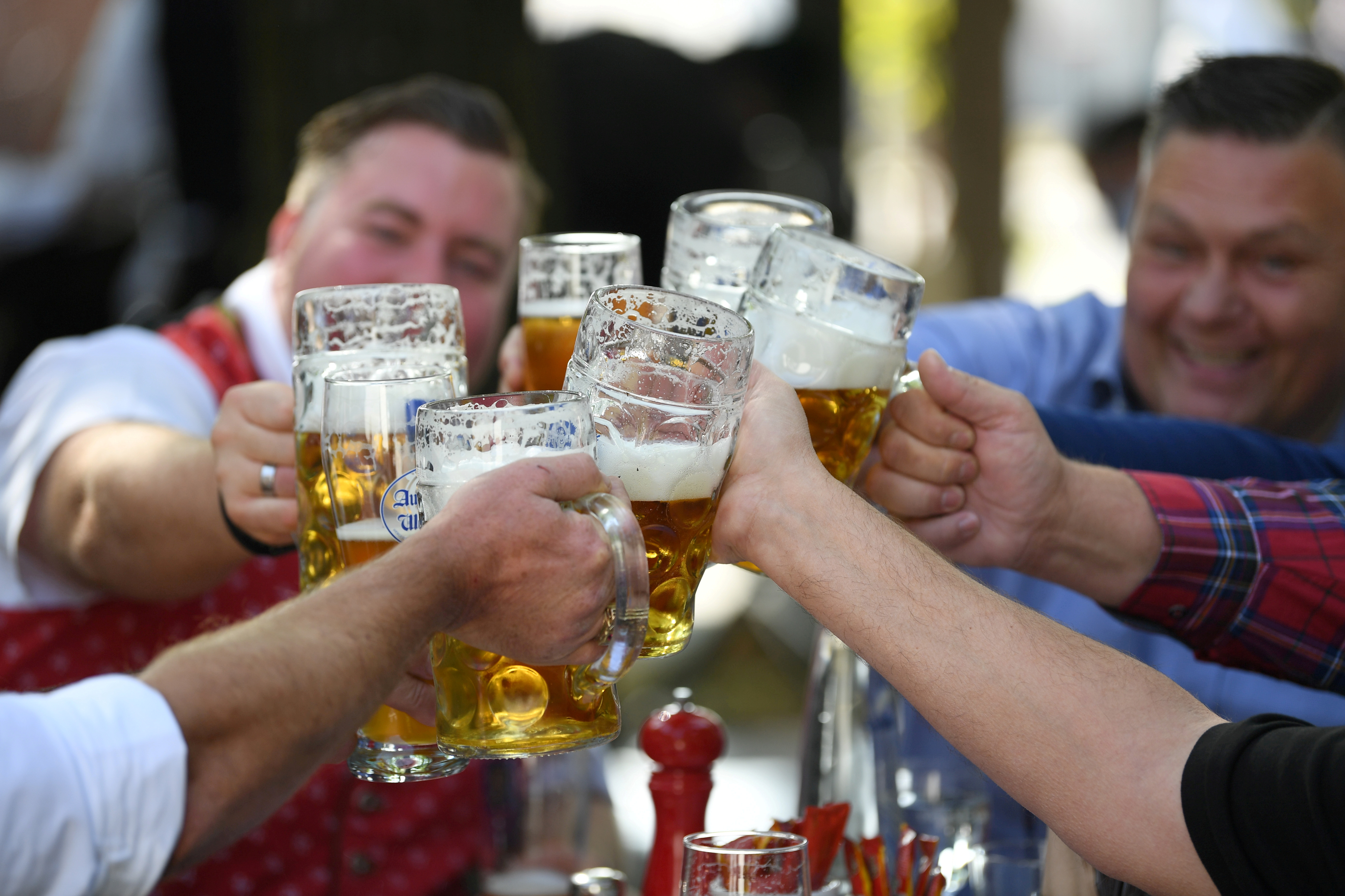 Beer garden guests salute near Theresienwiese where Oktoberfest would have started