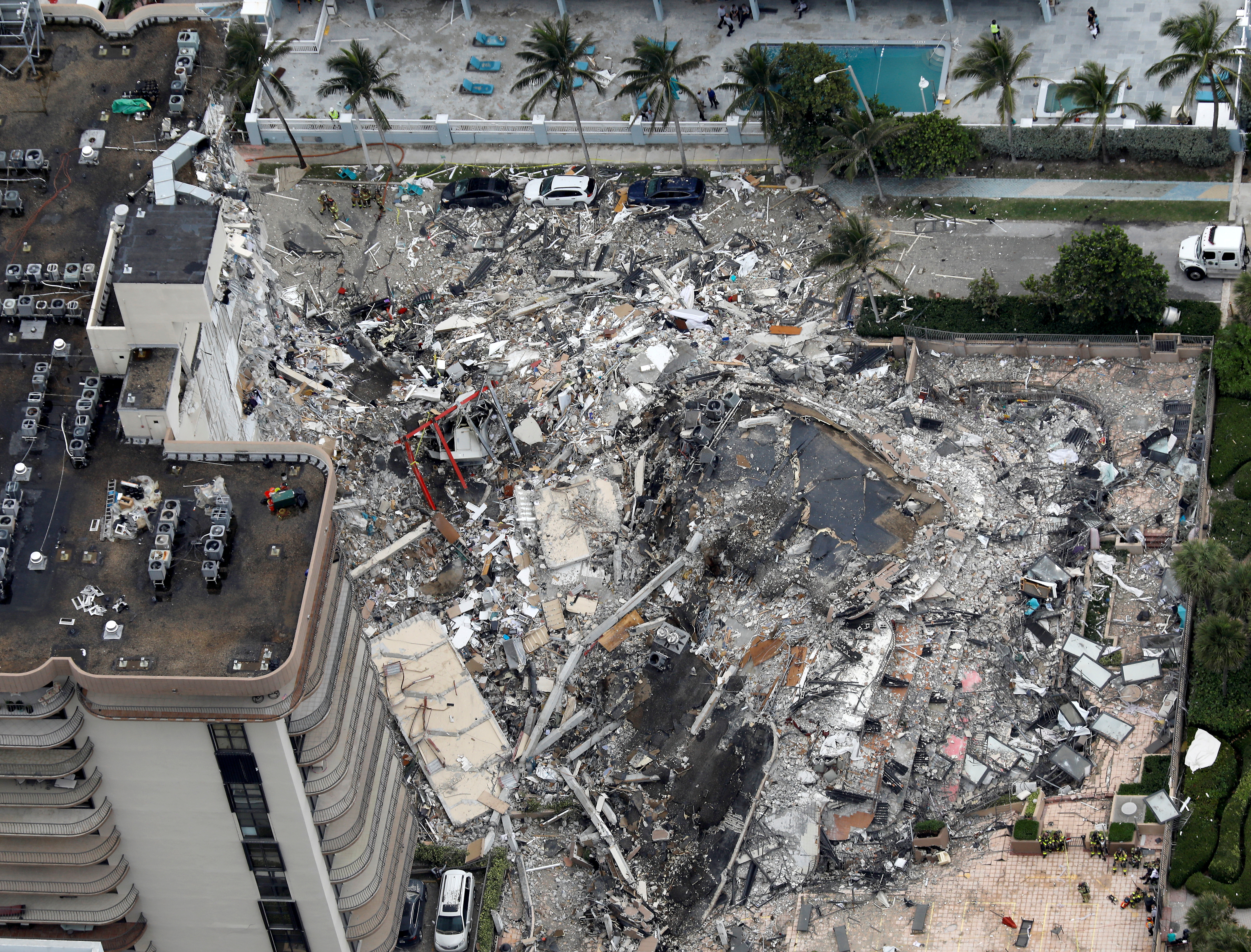 An aerial view showing a partially collapsed building in Surfside near Miami Beach