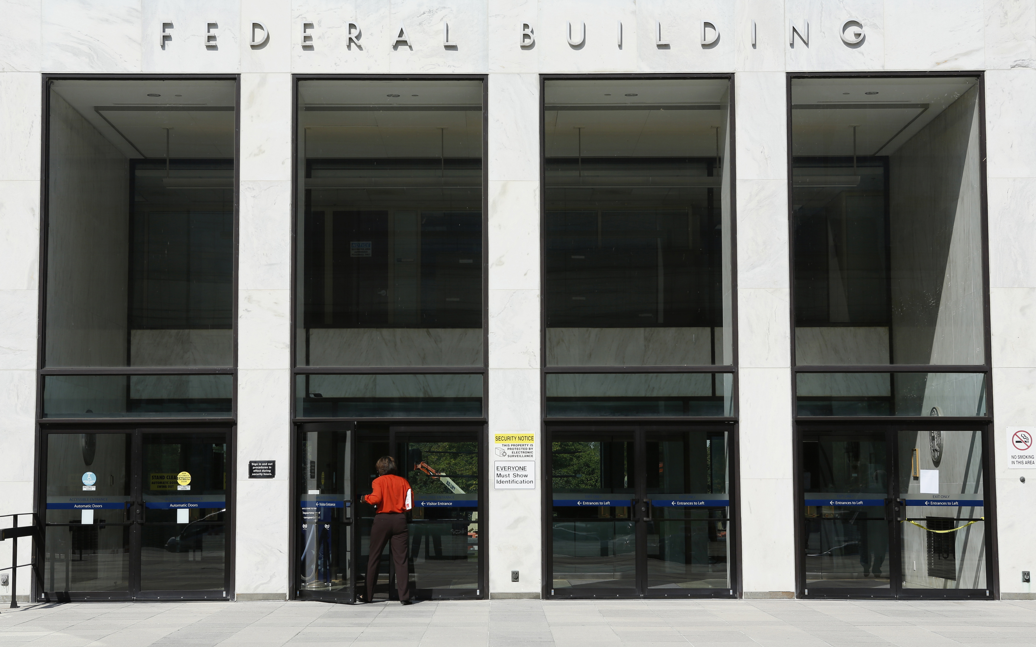 A worker enters a transportation department federal building in Washington