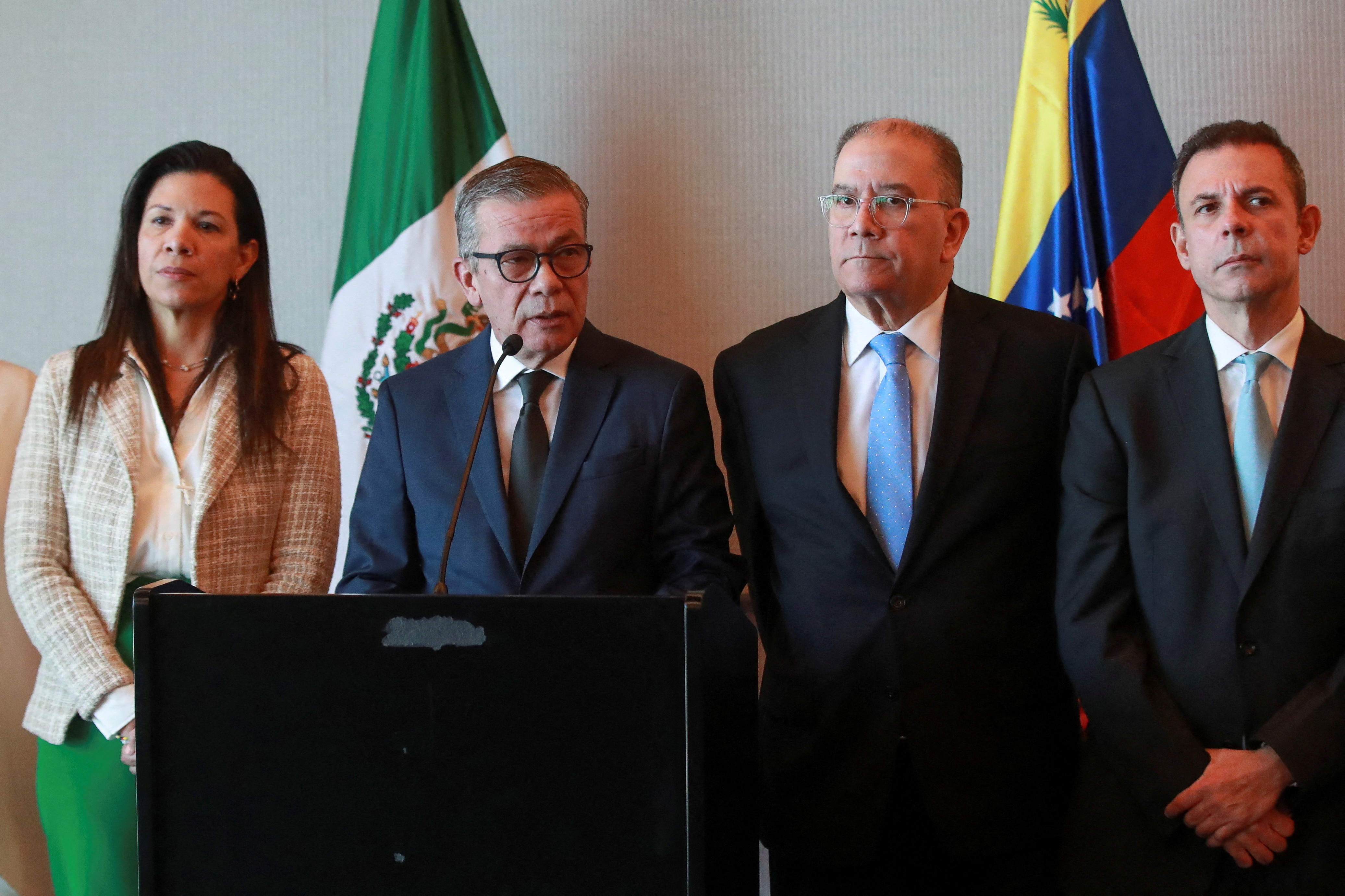 Delegates from talks between Venezuela's government and political opposition hold a news conference, in Mexico City