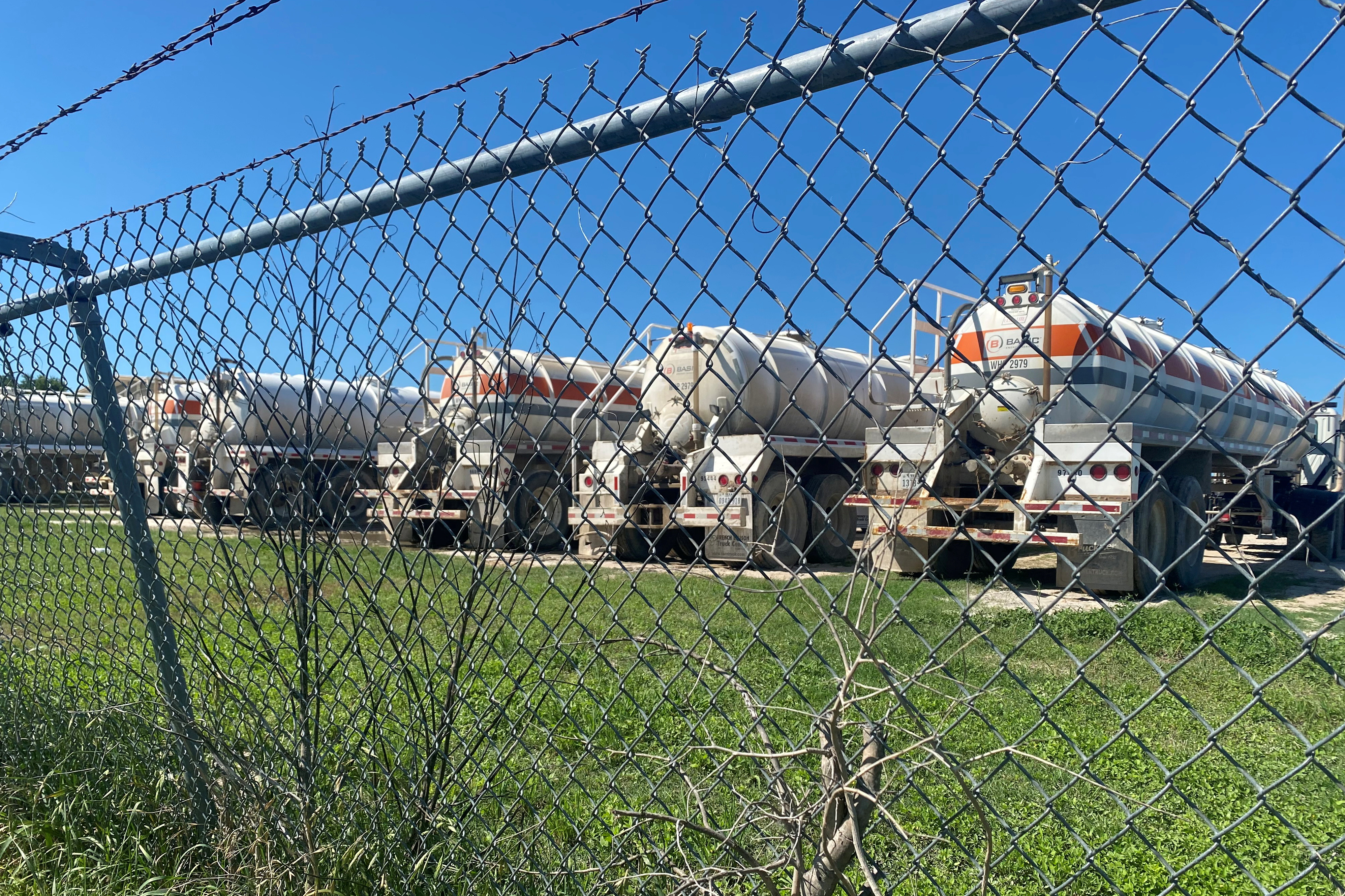 Oilfield equipment is parked at a Basic Energy Services site, as oil and gas activity dips in the Eagle Ford Shale oil field due to the coronavirus disease (COVID-19) pandemic and the drop in demand for oil globally, in Karnes County, Texas, U.S., May 18, 2020. Picture taken May 18, 2020. REUTERS/Jennifer Hiller/File Photo