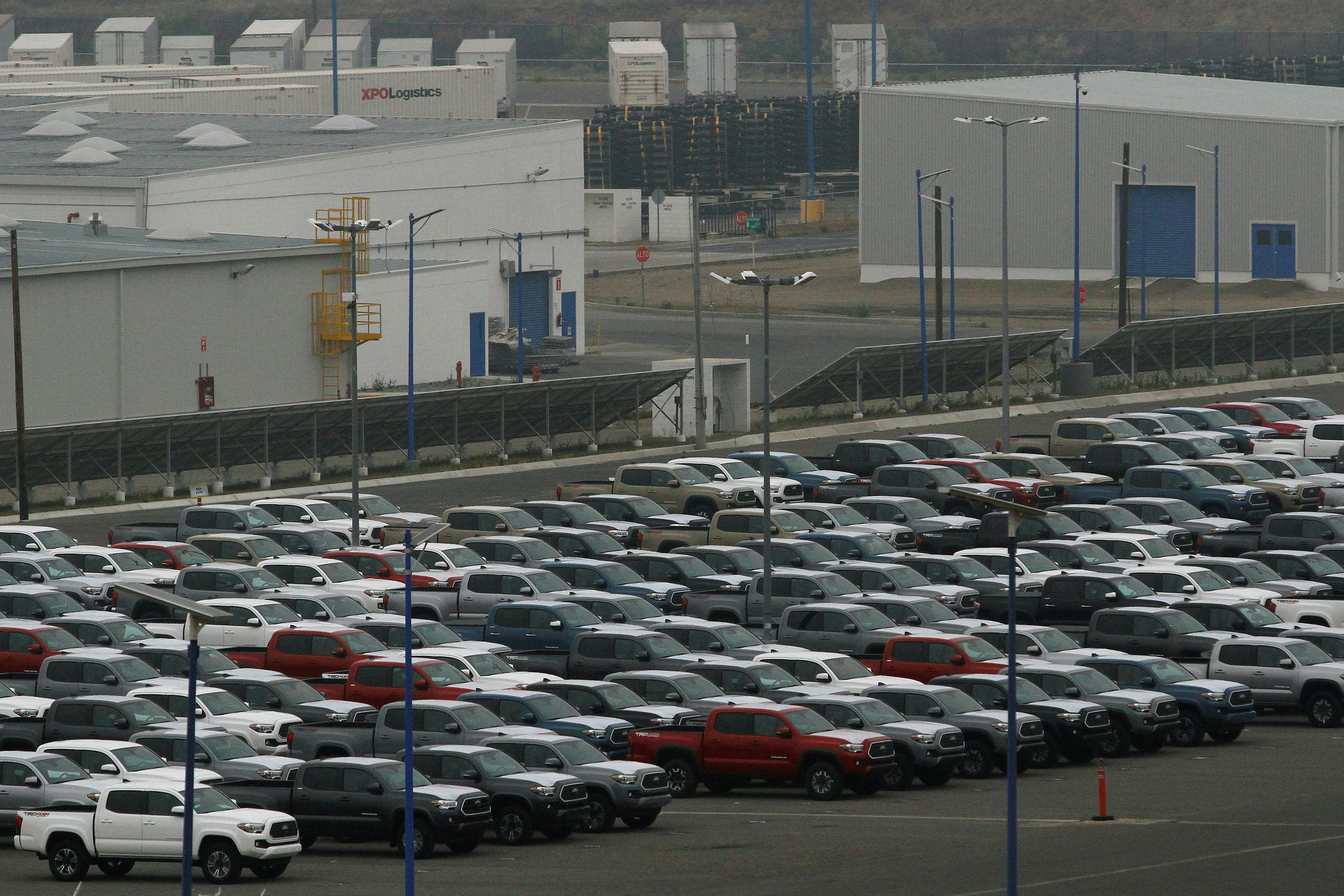 Newly assembled vehicles are parked at the Toyota Motor Manufacturing plant in Baja California