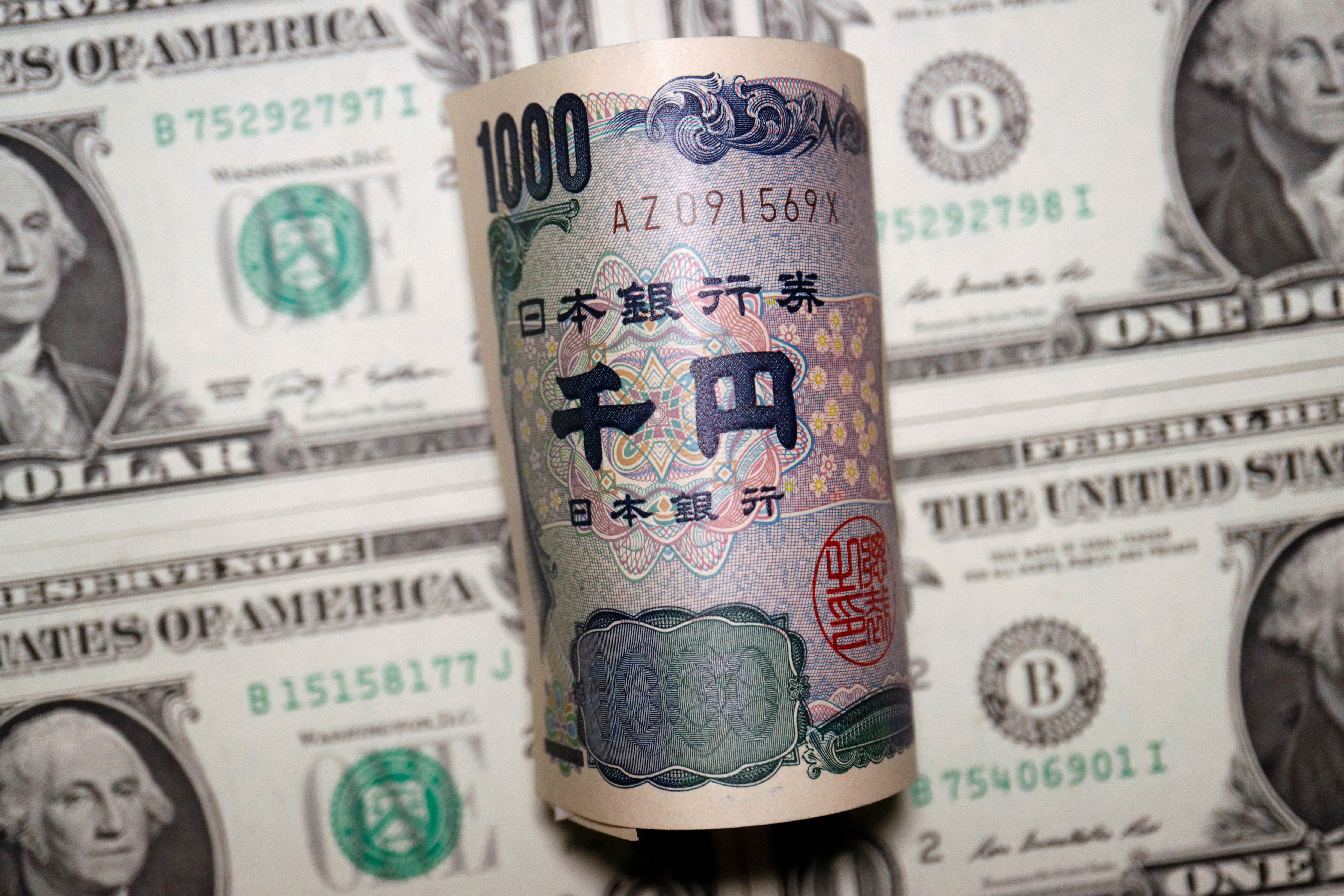 Illustration picture of Japanese yen and U.S. dollar banknotes