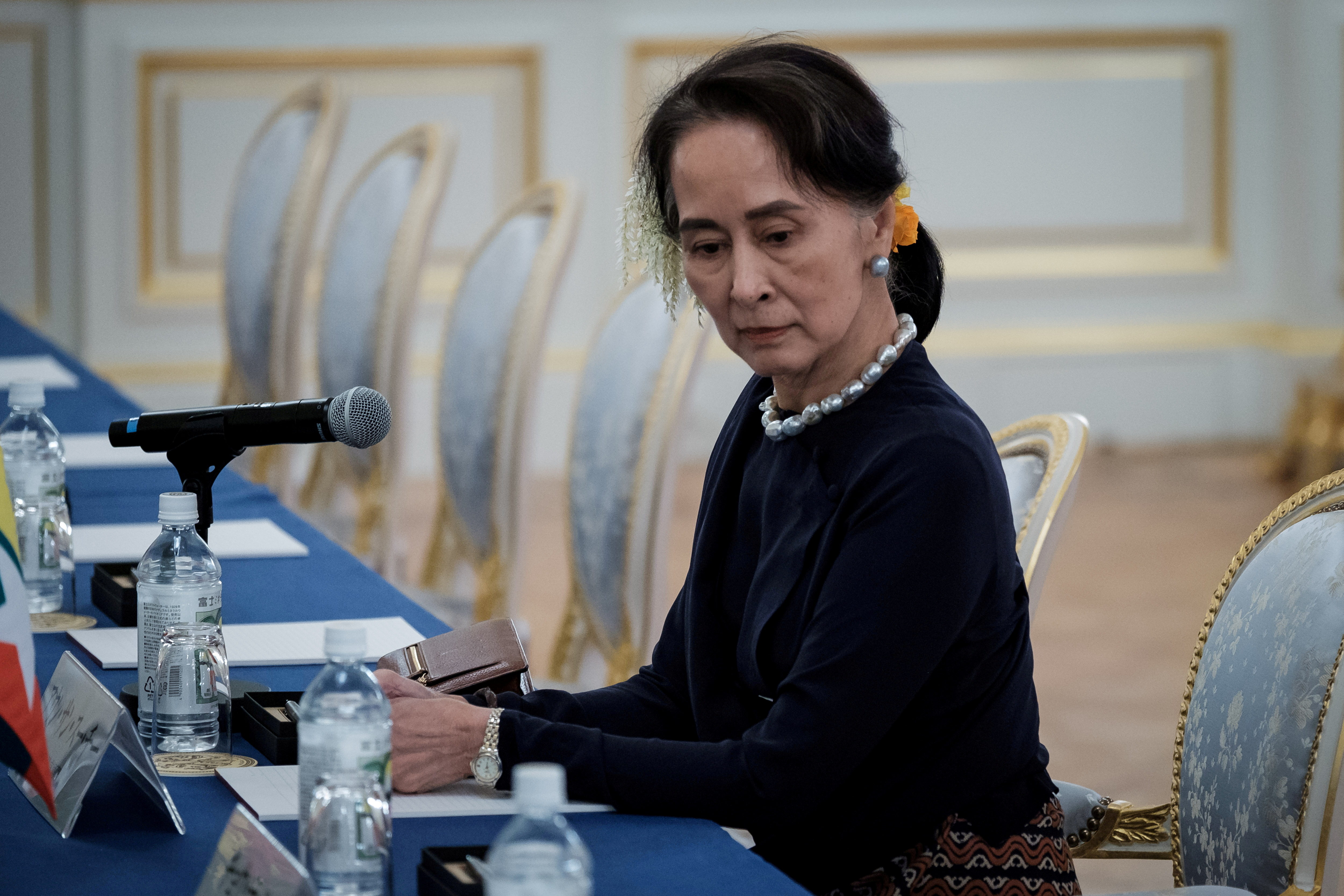 Myanmar's State Counsellor Aung San Suu Kyi waits for the arrival of her delegation before the Japan Myanmar Summit meeting with Japan's Prime Minster Shinzo Abe (not pictured) at Akasaka Palace State Guest House in Tokyo, Japan October 9, 2018.  Nicolas Datiche/Pool via Reuters