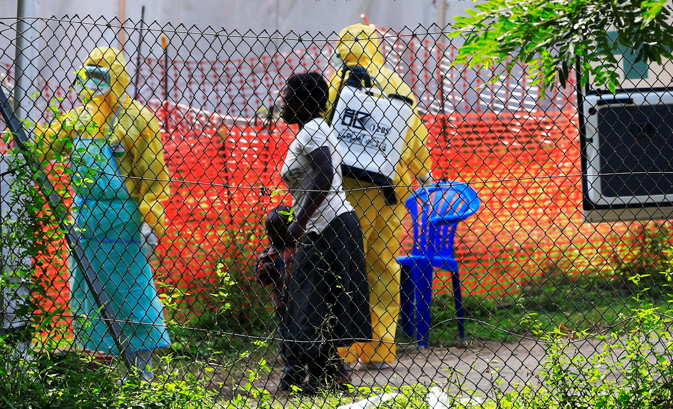 A woman and her child arrive for ebola related investigation at the health facility at the Bwera general hospital near the border with the Democratic Republic of Congo in Bwera