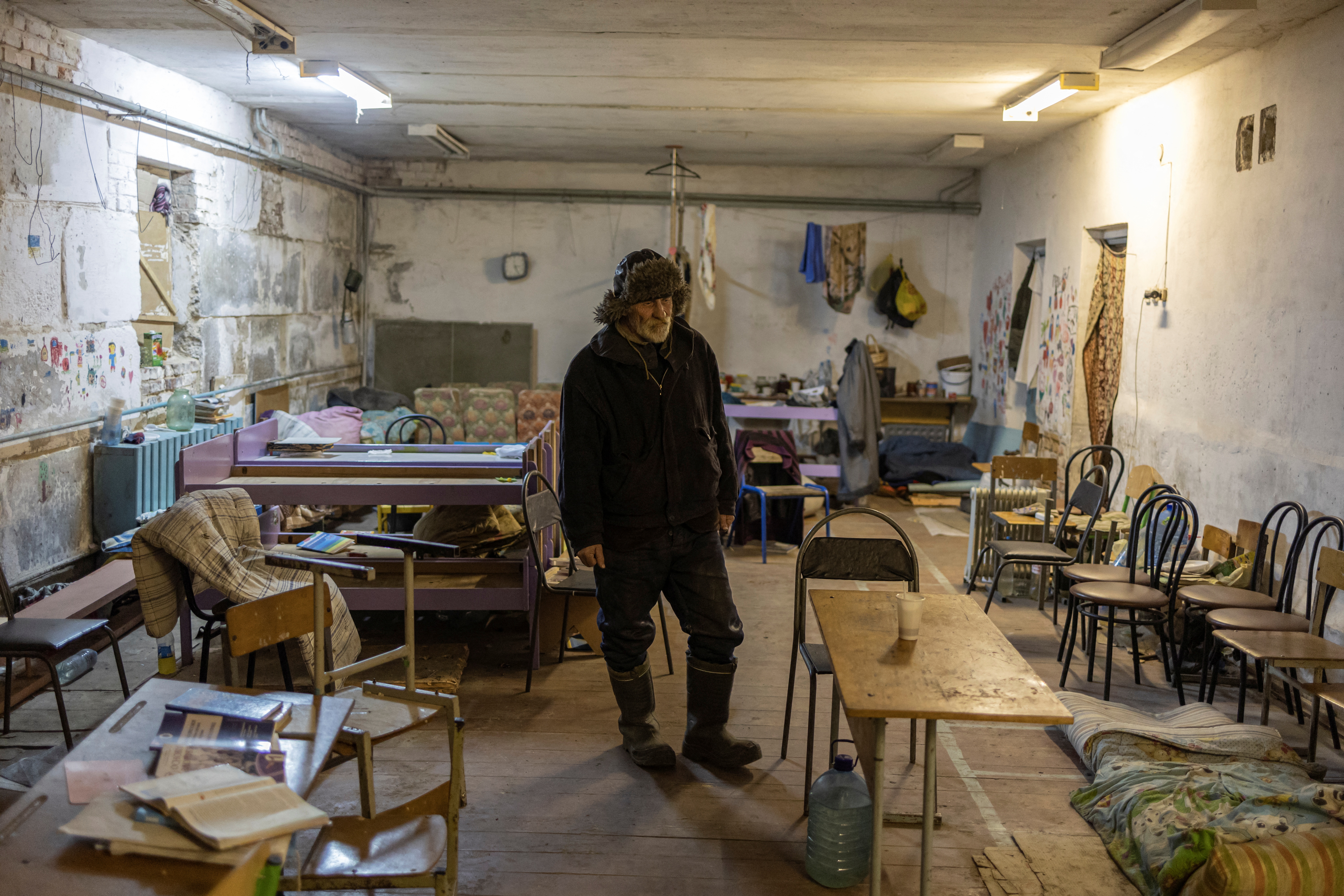 The Wider Image: Ukrainian villagers count dead after weeks confined in school basement