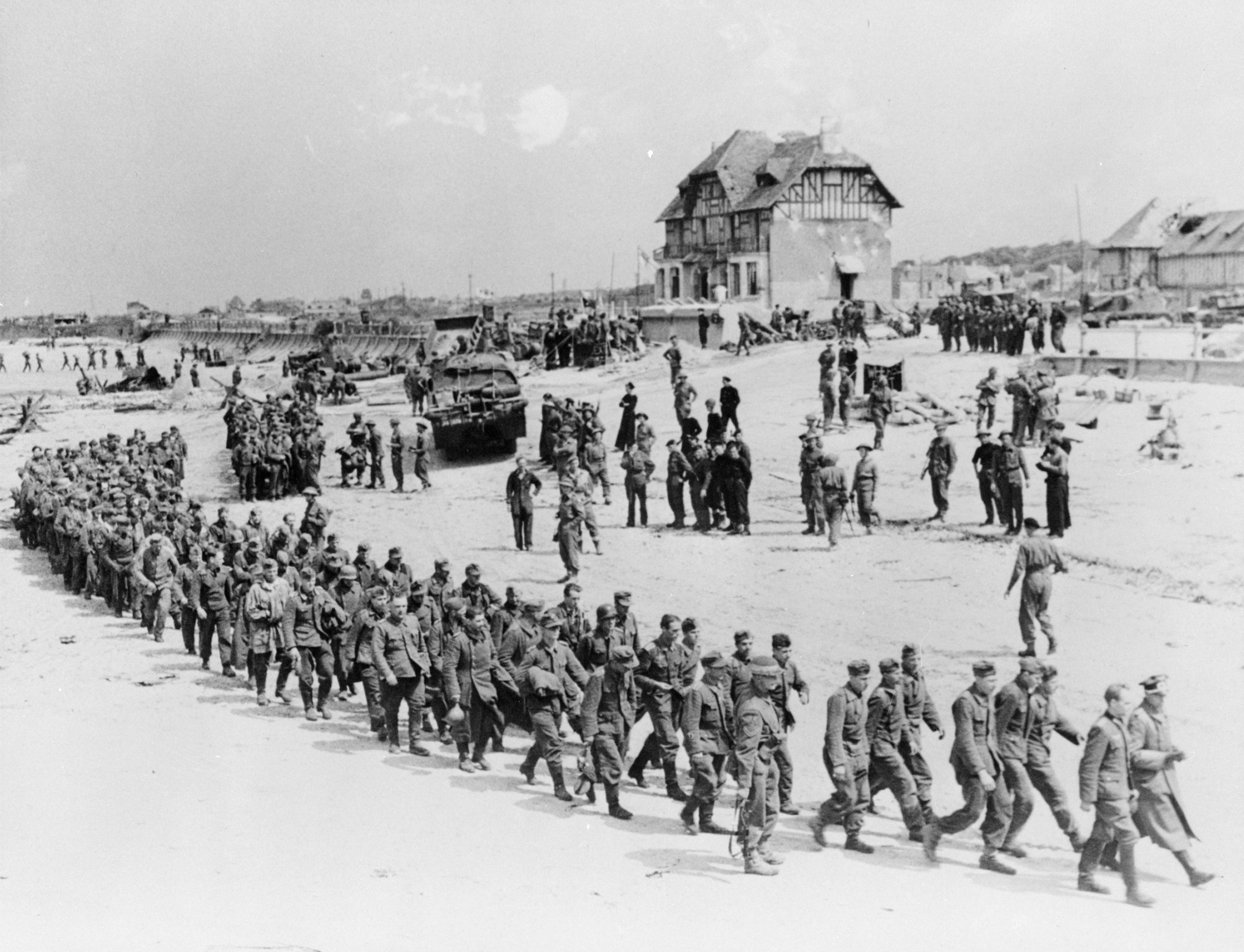 Handout photo of German POWs marching along Juno Beach landing area at Bernieres Sur Mer