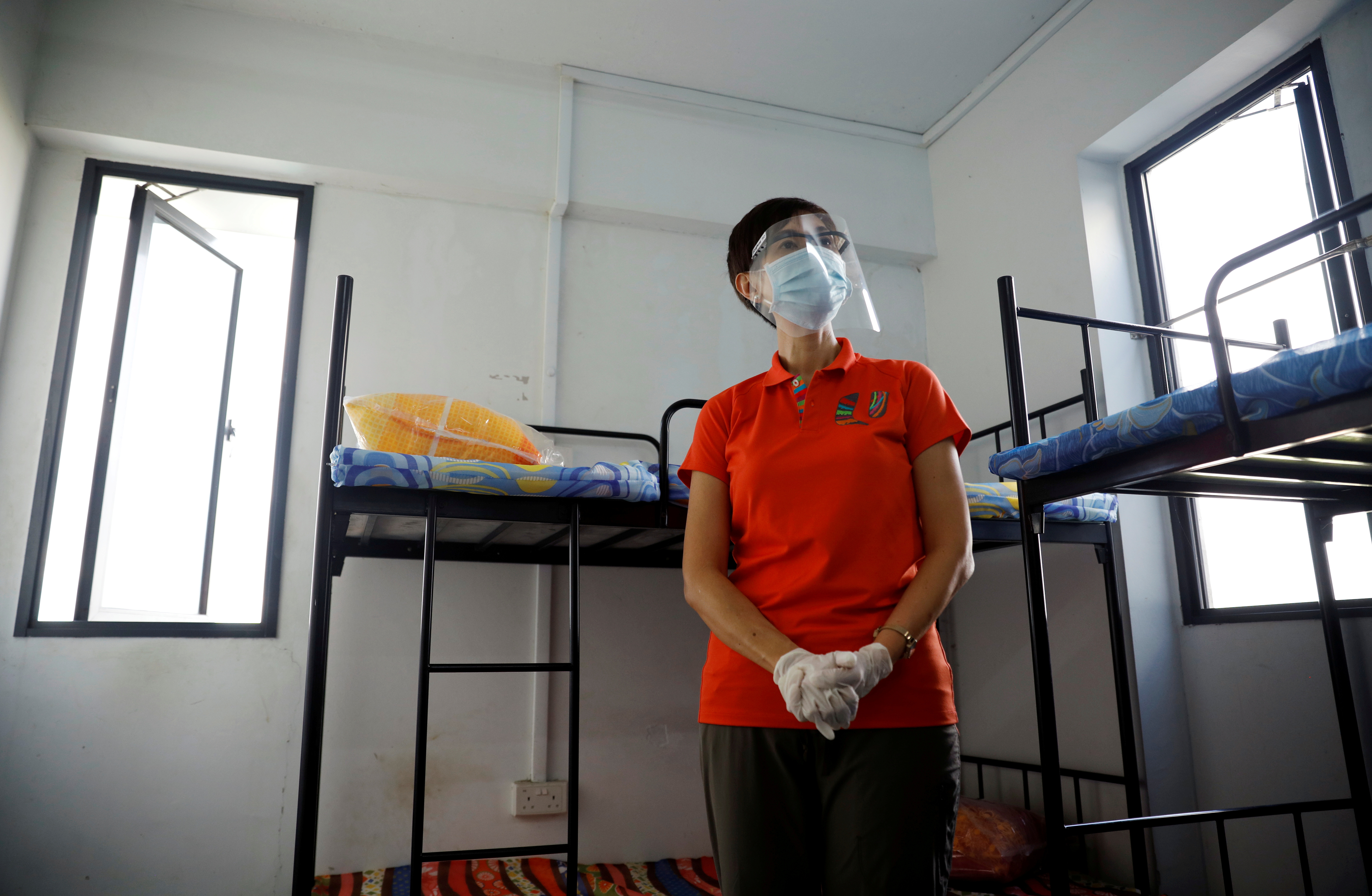 Singapore's Minister of Manpower Josephine Teo tours a dormitory room for migrant workers who have recovered from the coronavirus disease (COVID-19), amid the outbreak in Singapore May 15, 2020.  REUTERS/Edgar Su