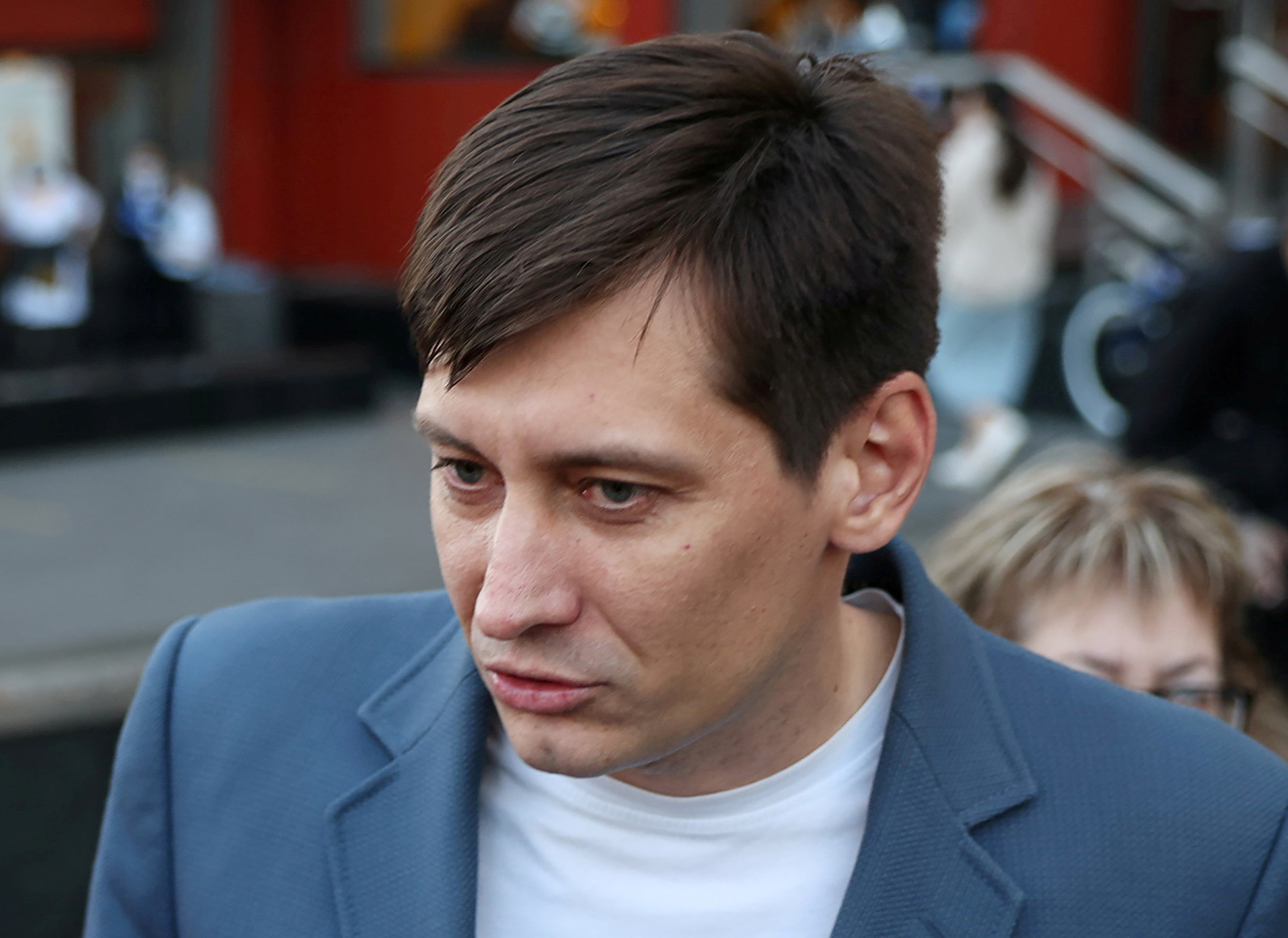 Russian opposition politician Dmitry Gudkov speaks to the media after being released from custody in Moscow