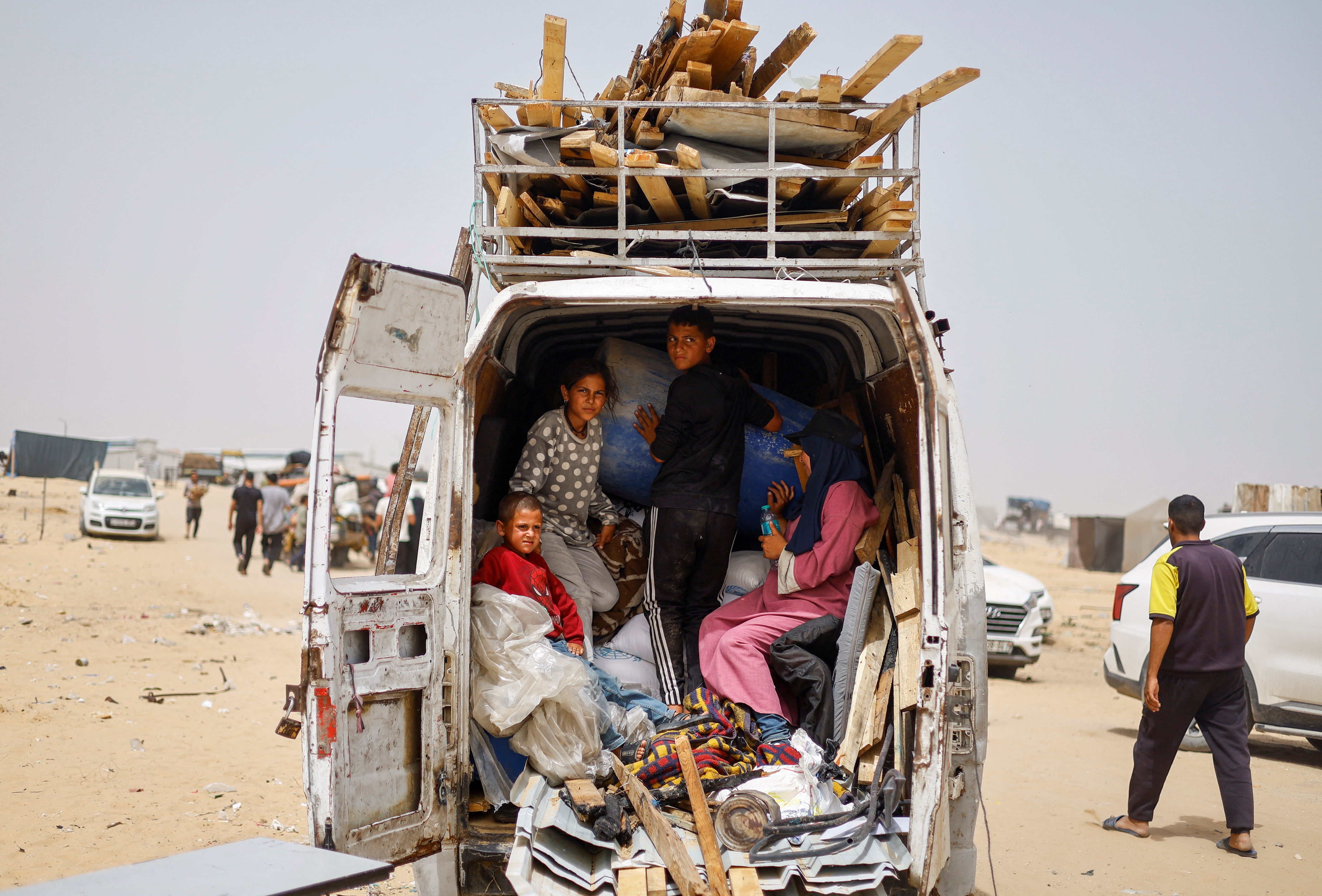 Palestinians flee Rafah following a nearby Israeli strike on an area designated for displaced
