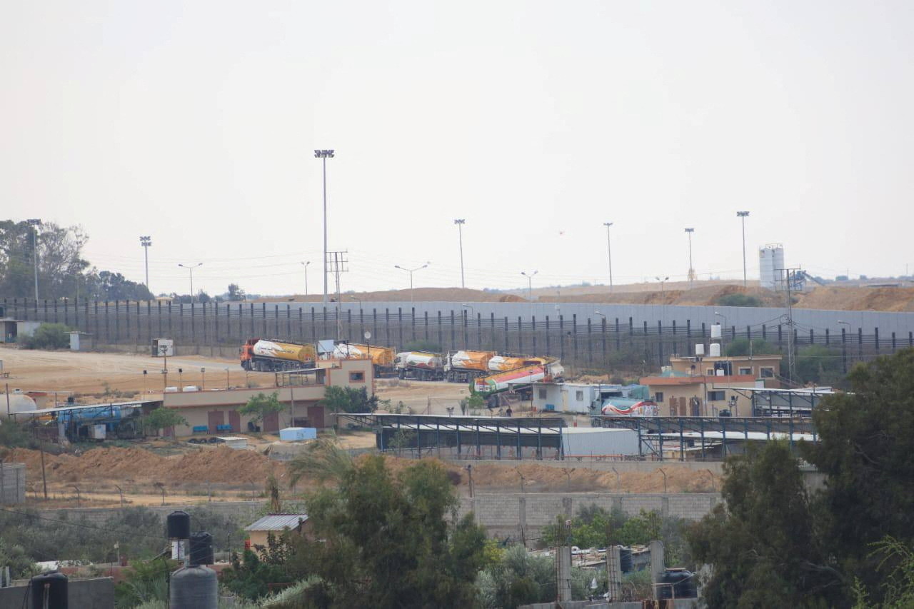Trucks carrying aid are seen near the Rafah border in Gaza after entering from Egypt