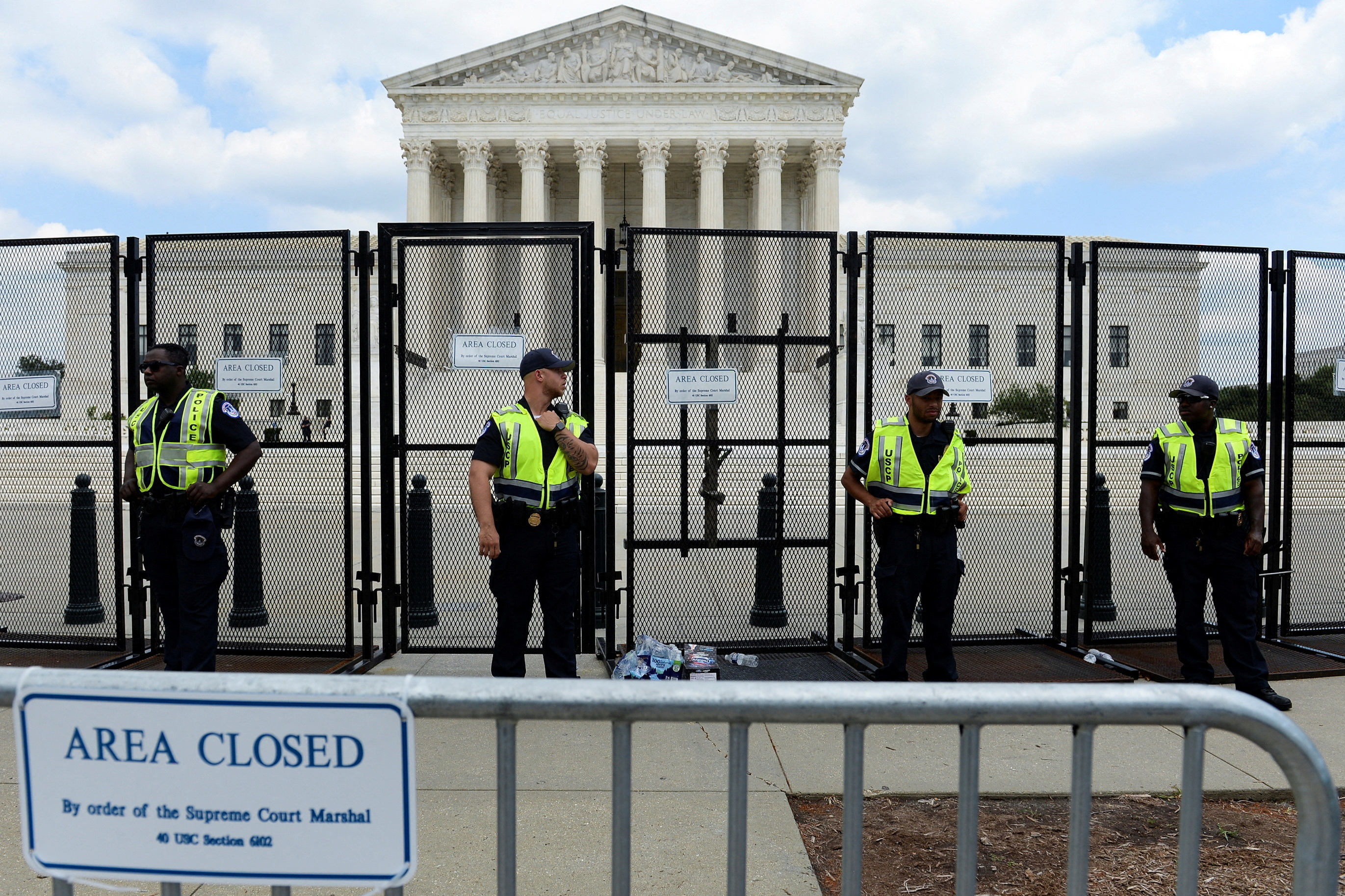 Supreme Court Police line up outside the United States Supreme Court, in Washington