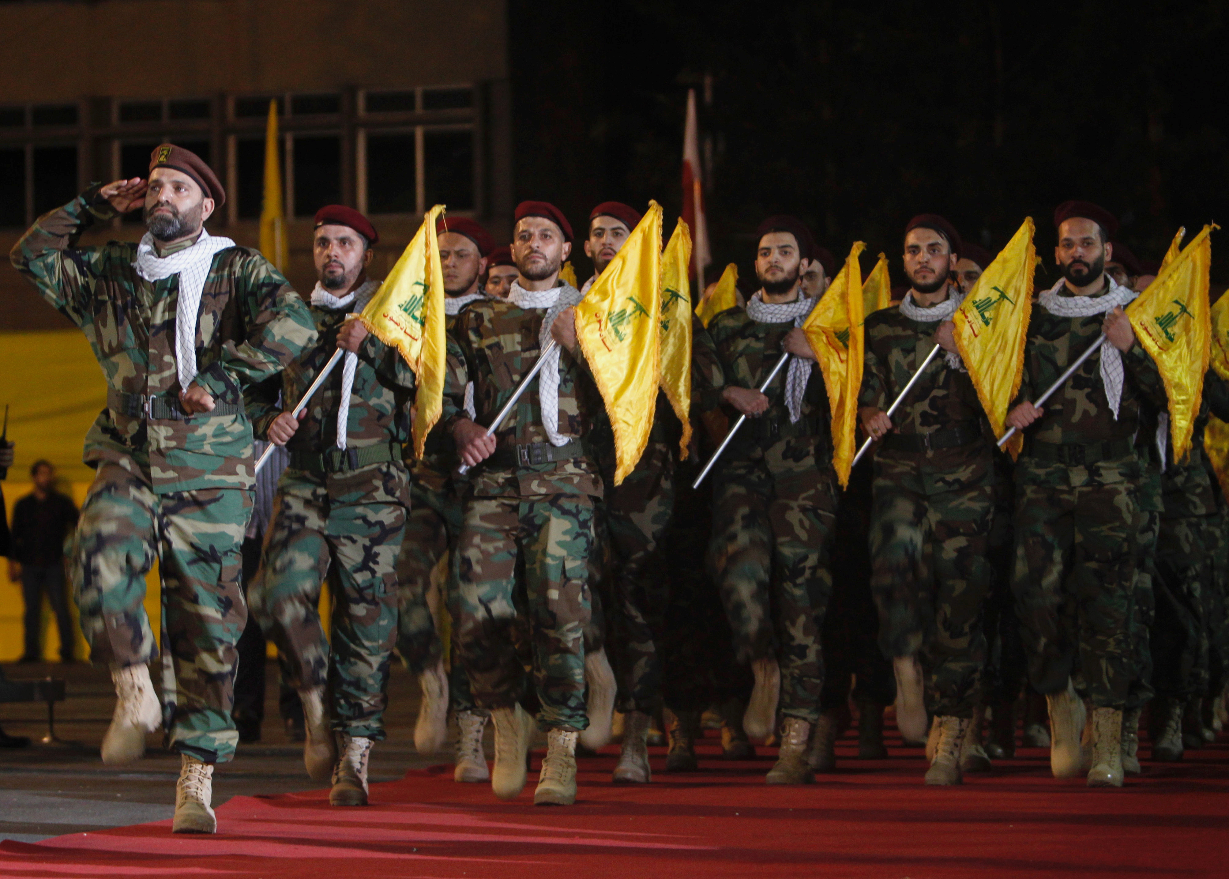 Members of Hezbollah march with party's flags during a rally marking al-Quds Day, (Jerusalem Day) in Beirut