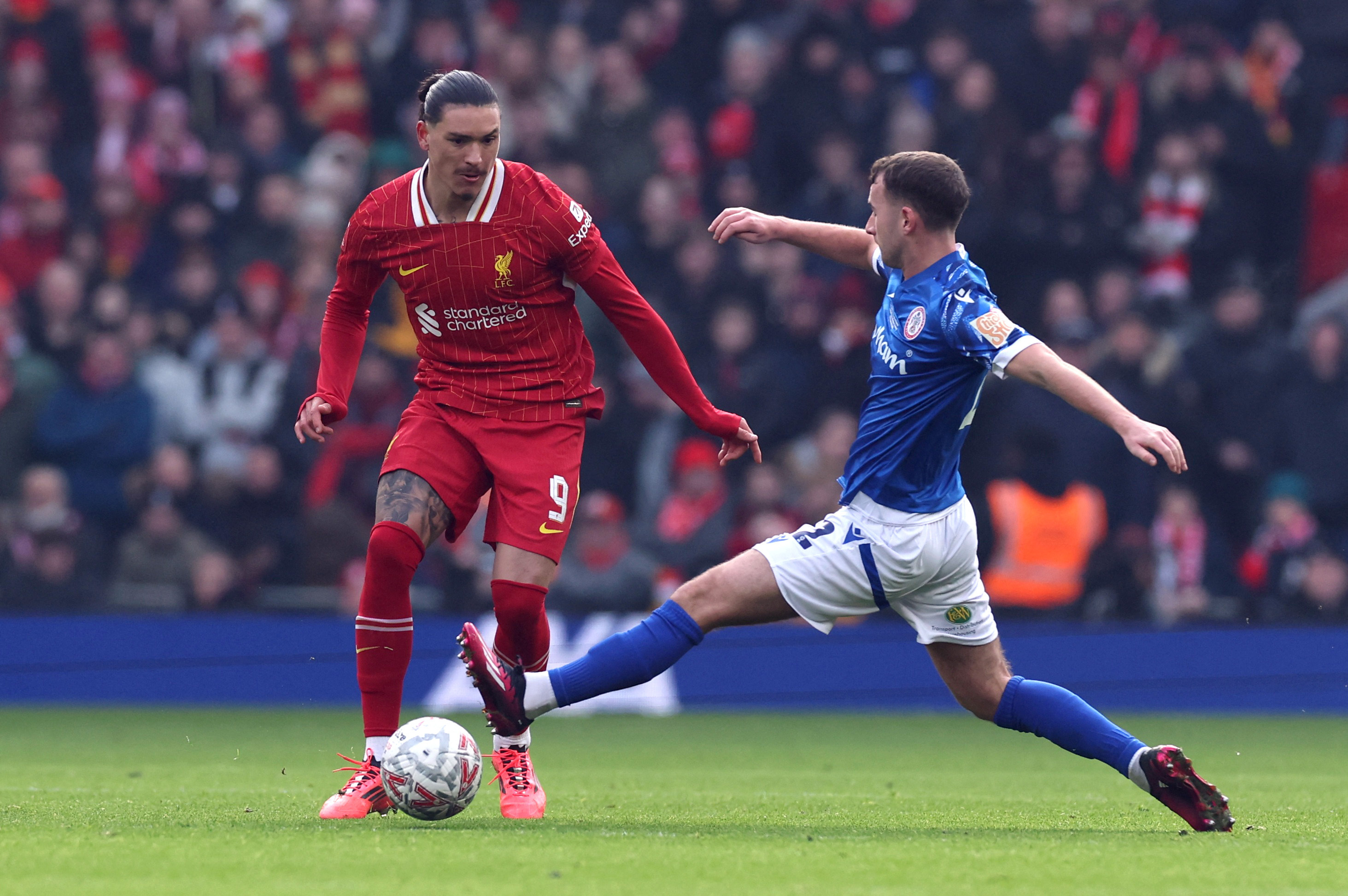 Soccer-Liverpool and Man City march into FA Cup round four
