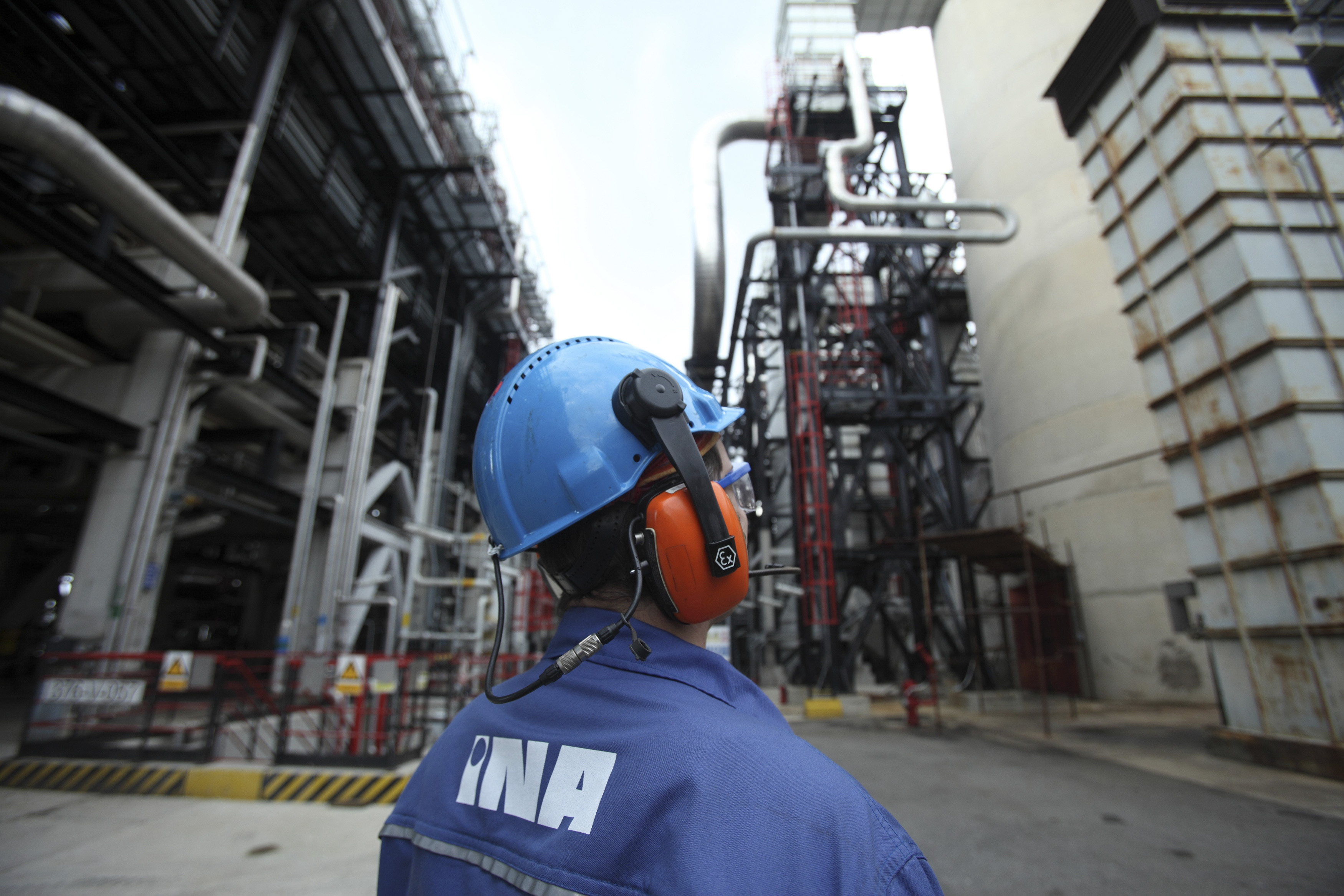 A worker looks on at plant in INA's oil refinery in Rijeka