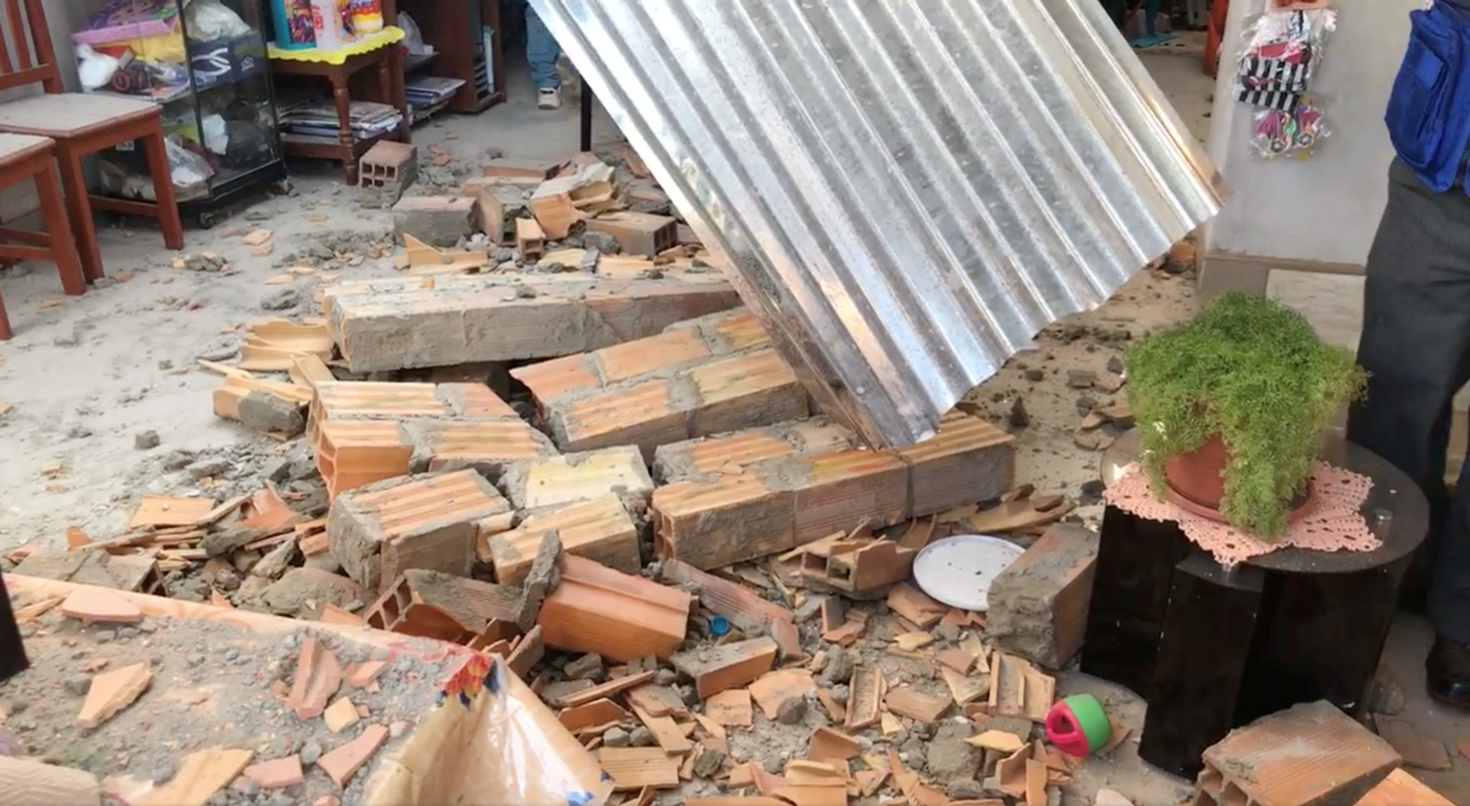 Damages are seen after an earthquake in Moyobamba, Peru, November 28, 2021 in this screengrab obtained from a social media video. INTERACTIVA RADIO TV/via REUTERS  MUST CREDIT INTERACTIVA RADIO TV. 