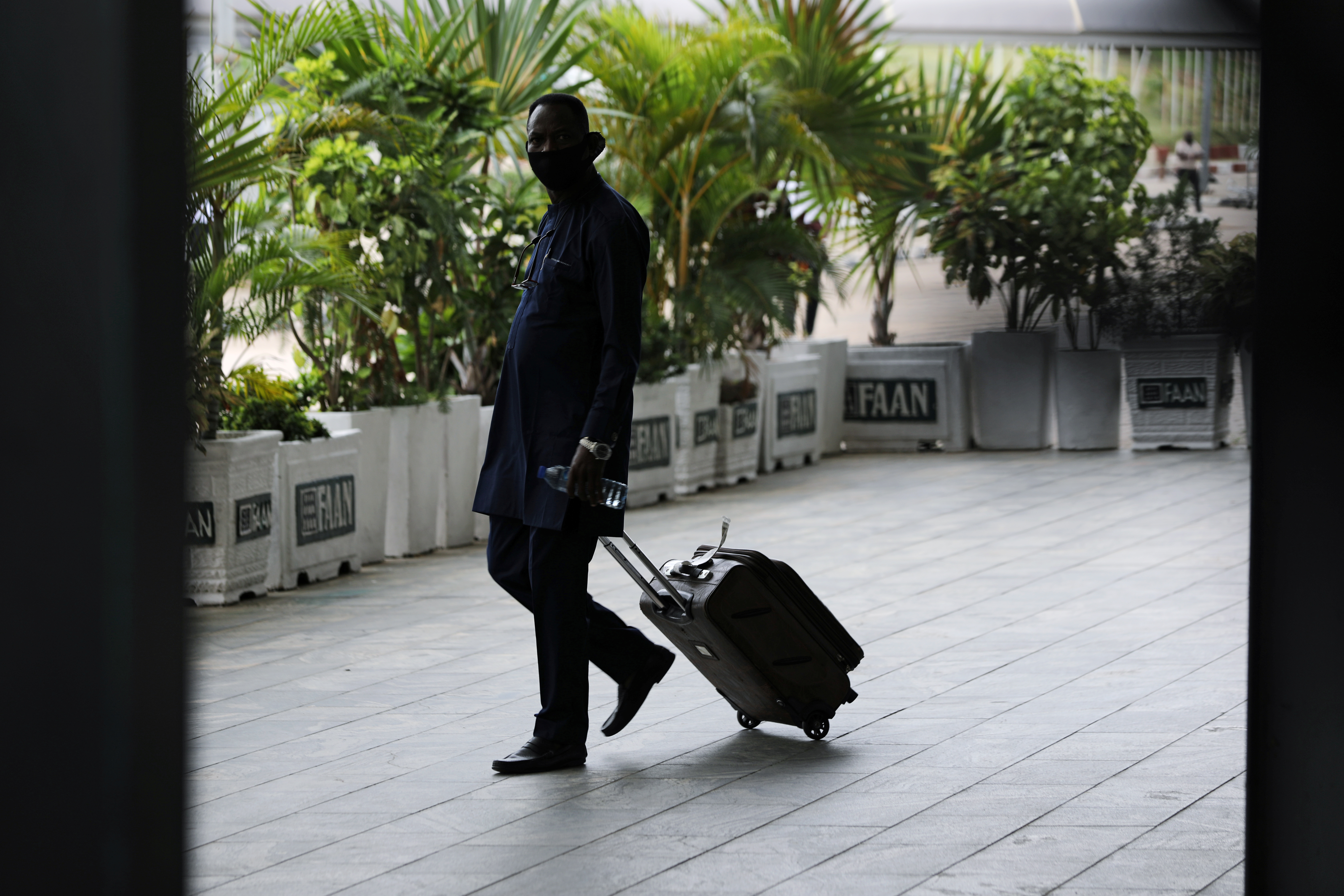 A man is seen on arrival at the domestic wing of the Nnamdi Azikiwe International Airport on its re-opening day for domestic flight operations, following the coronavirus disease (COVID-19) outbreak, in Abuja