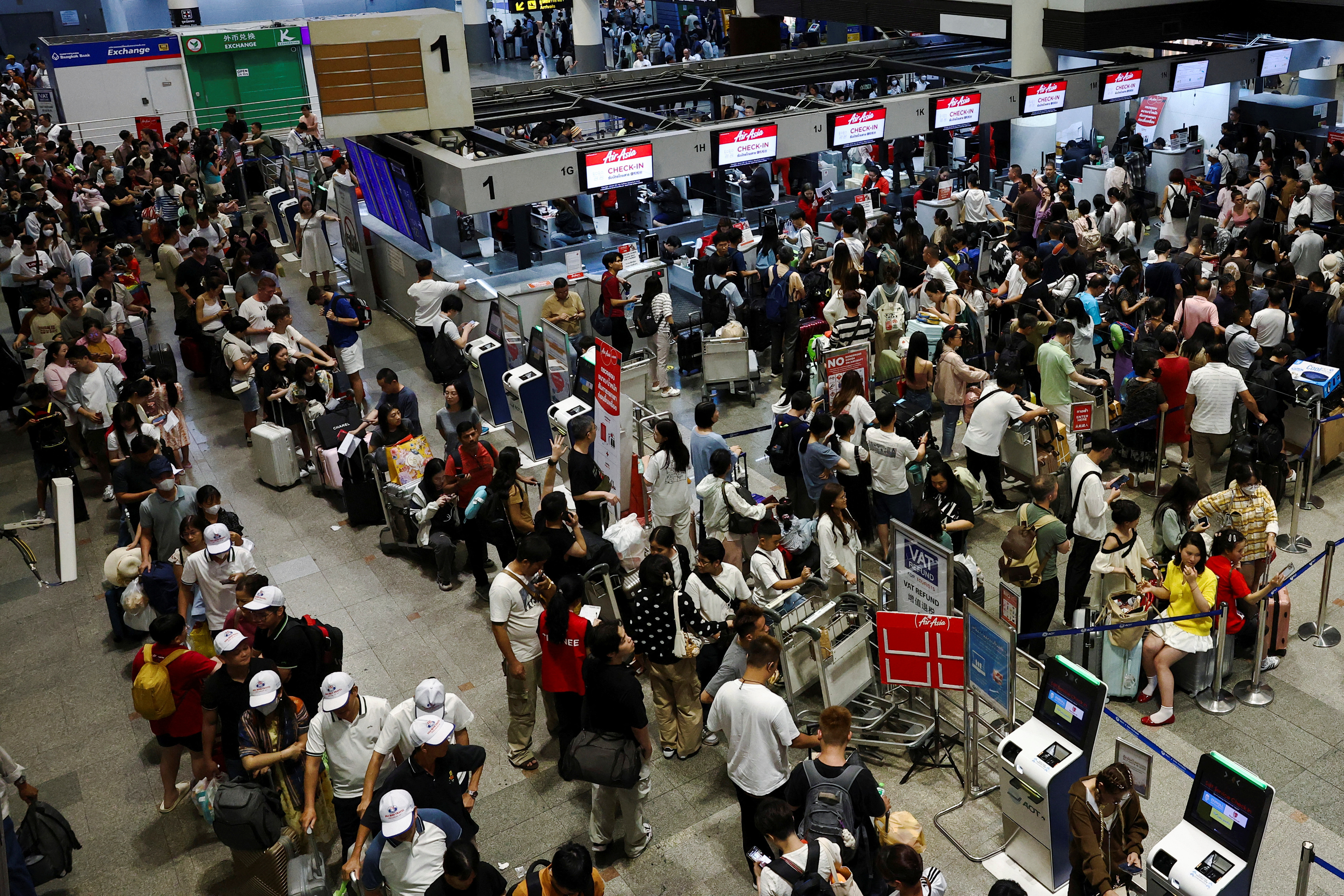 Don Mueang International Airport Terminal 1 amid system outages disrupting the airline's operations in Bangkok