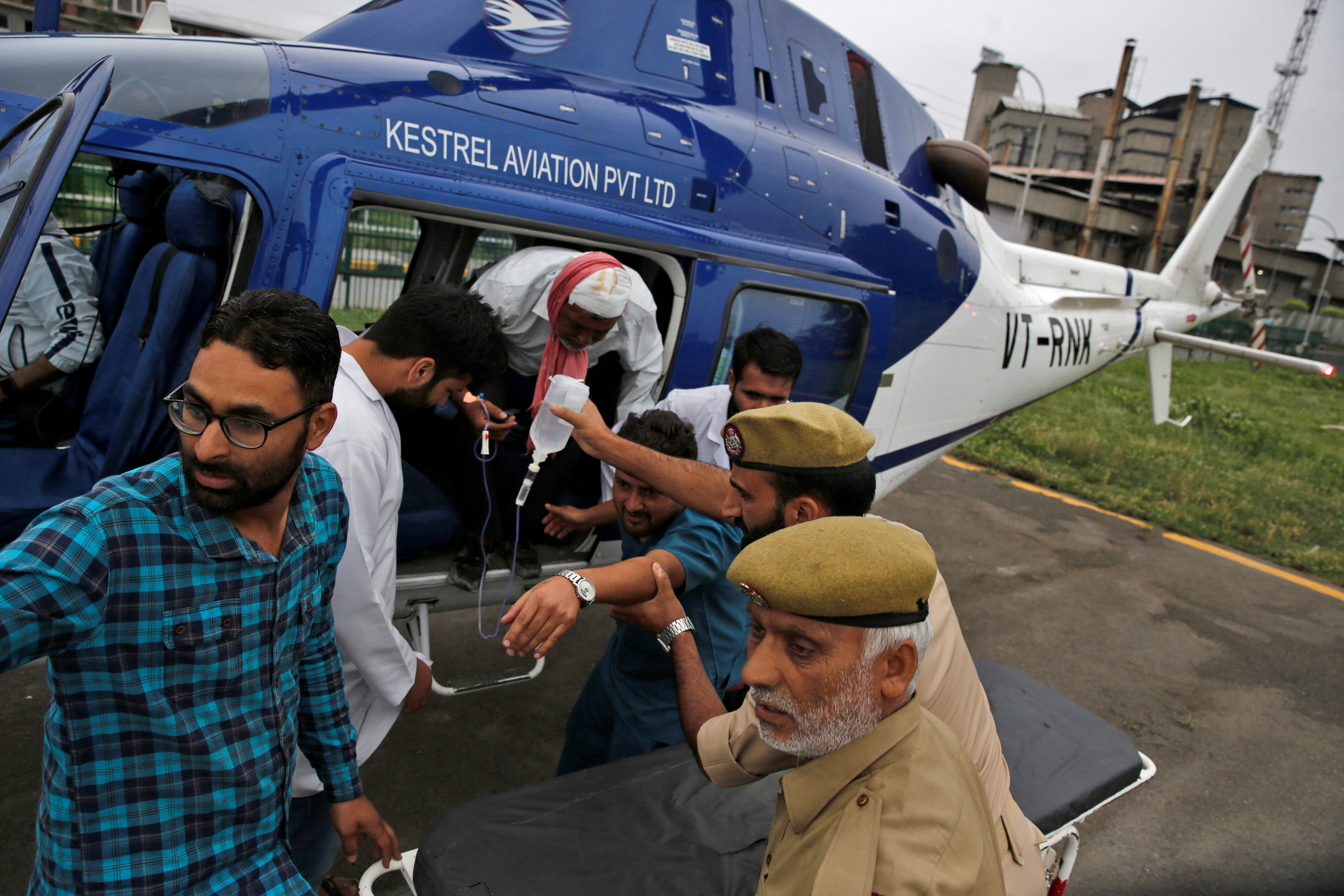 An injured is rushed for treatment at Sher-i-Kashmir Institute of Medical Sciences hospital in Srinagar