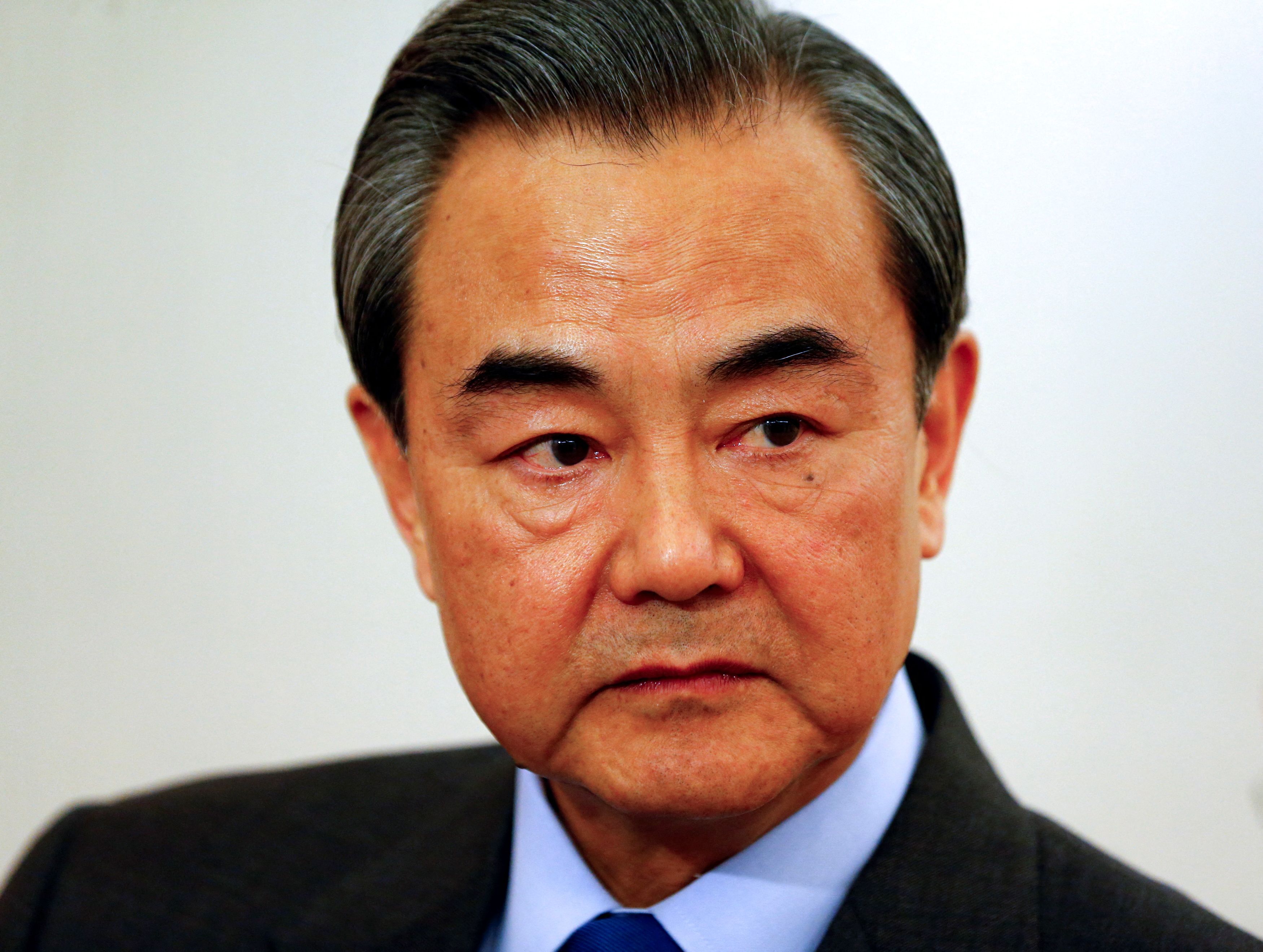 China's Foreign Minister Wang answers reporter's questions during a Reuters interview in Munich
