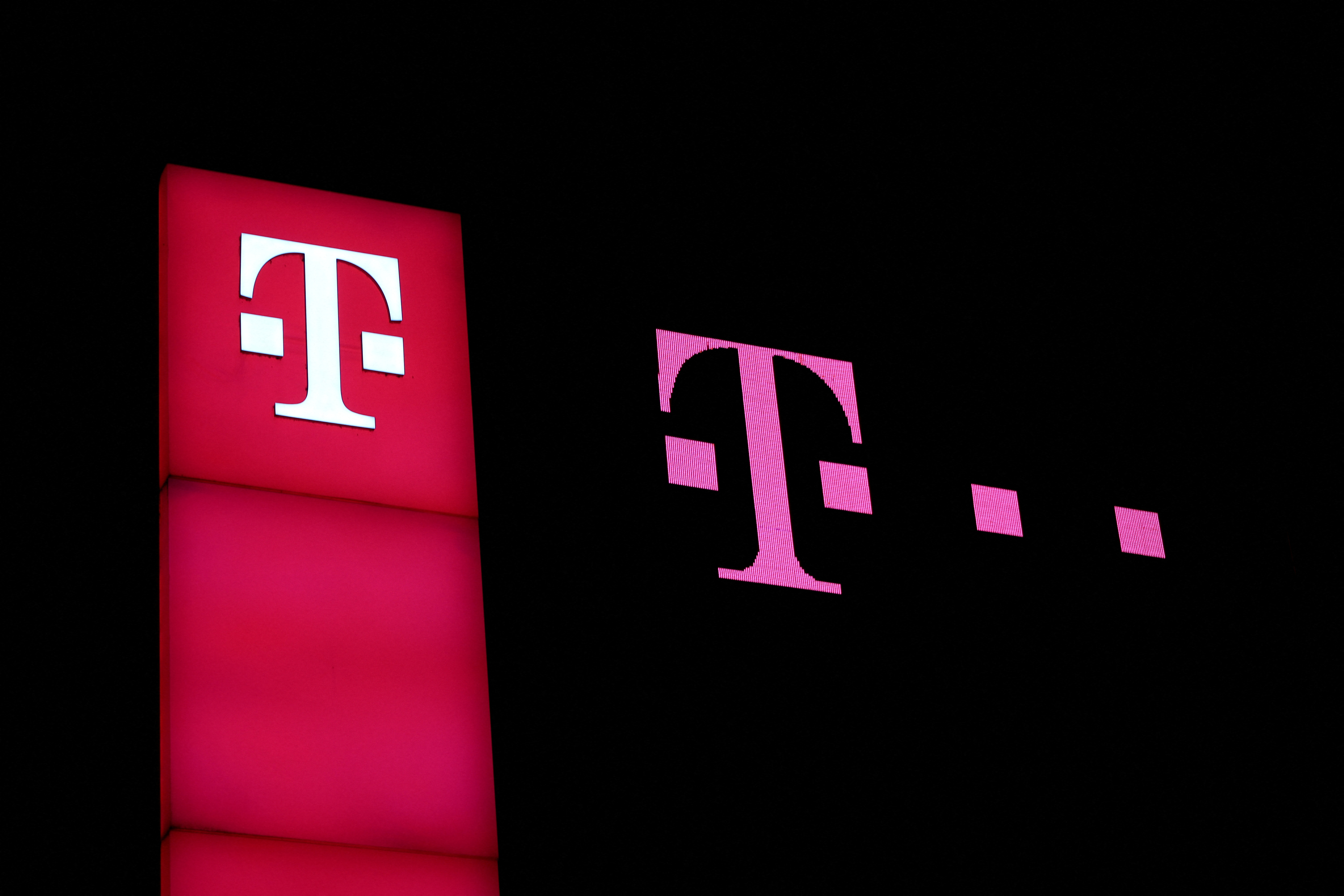 Deutsche Telekom signs are pictured on the headquarters of the German telecoms giant in Bonn
