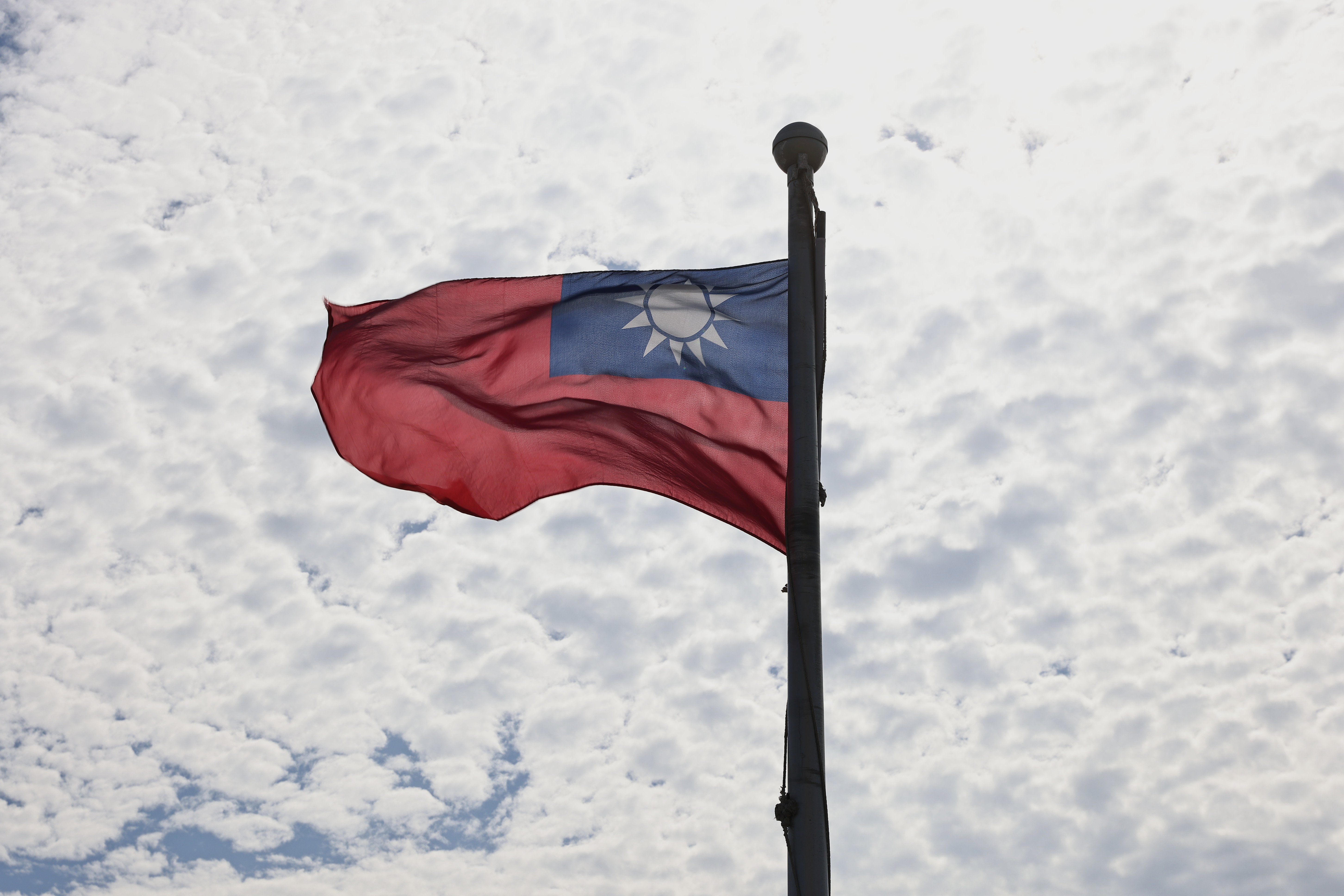 A Taiwanese flag flaps in the wind in Taoyuan