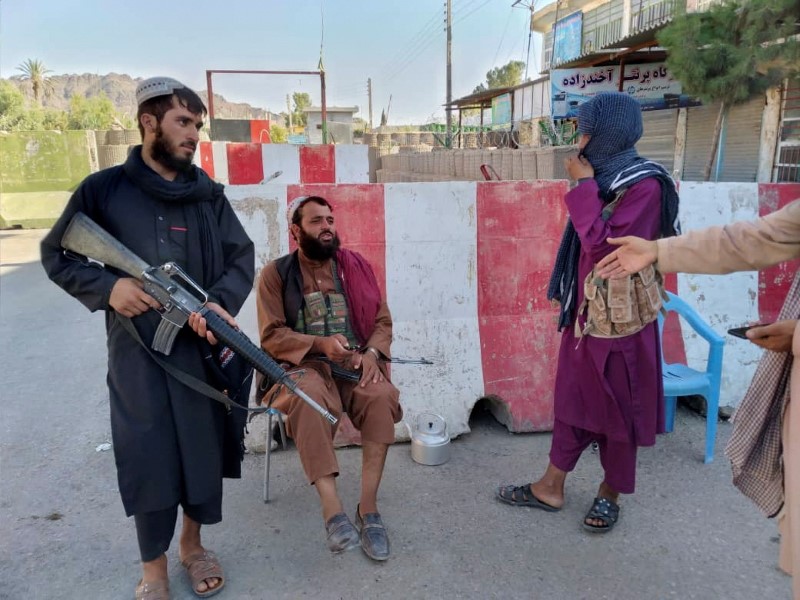 Taliban fighters stand guard at a check point in Farah, Afghanistan August 11, 2021. REUTERS/Stringer 