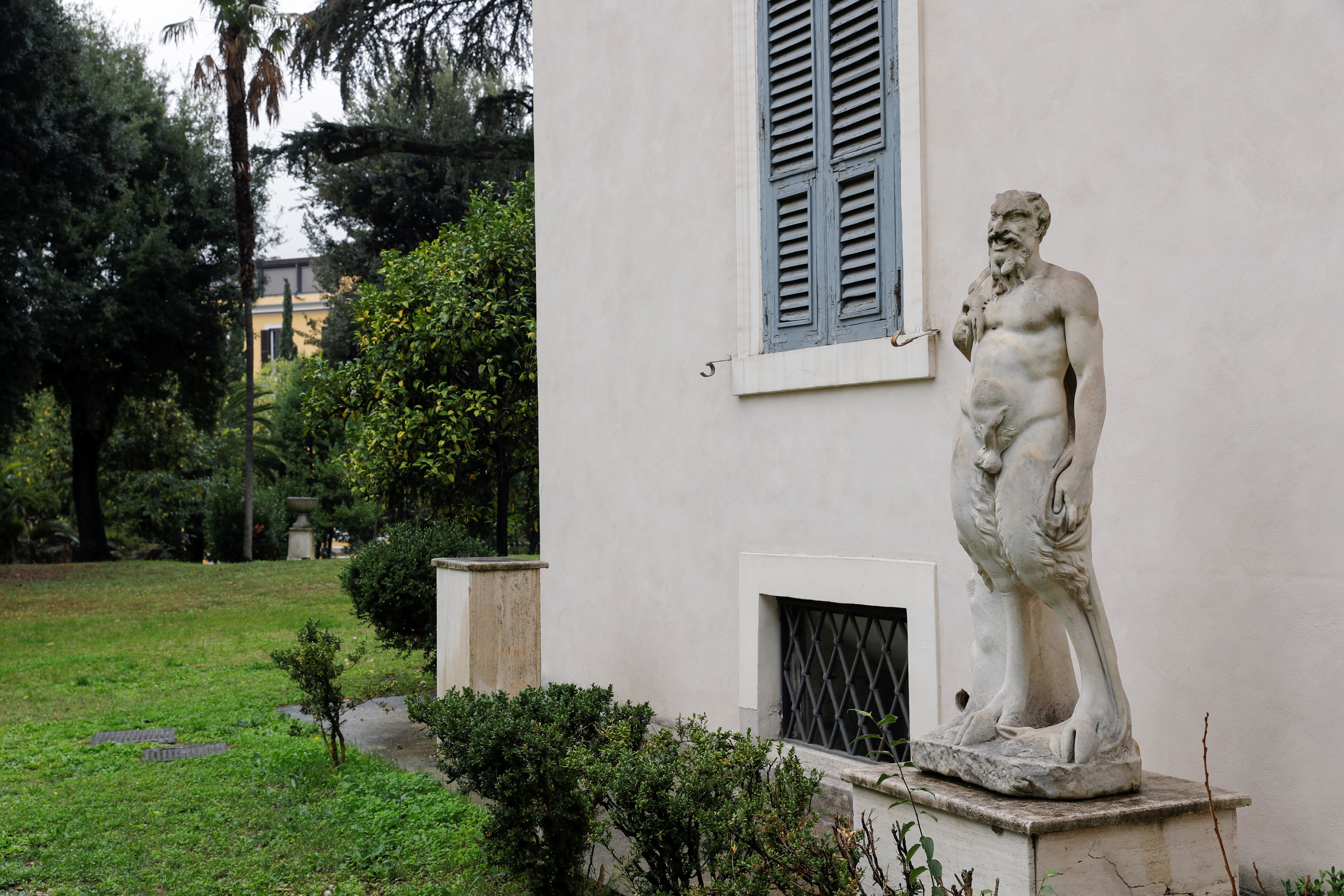 A statue of Pan by Michelangelo is seen outside Villa Aurora, a building that boasts Caravaggio's only ceiling mural, which is up for auction in January with an opening bid set at 471 million euros, in Rome, Italy, November 16, 2021. REUTERS/Remo Casilli