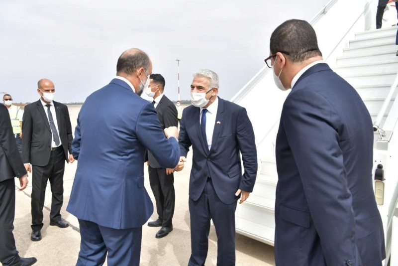 Israeli Foreign Minister Yair Lapid is welcomed upon his arrival at the airport in Rabat