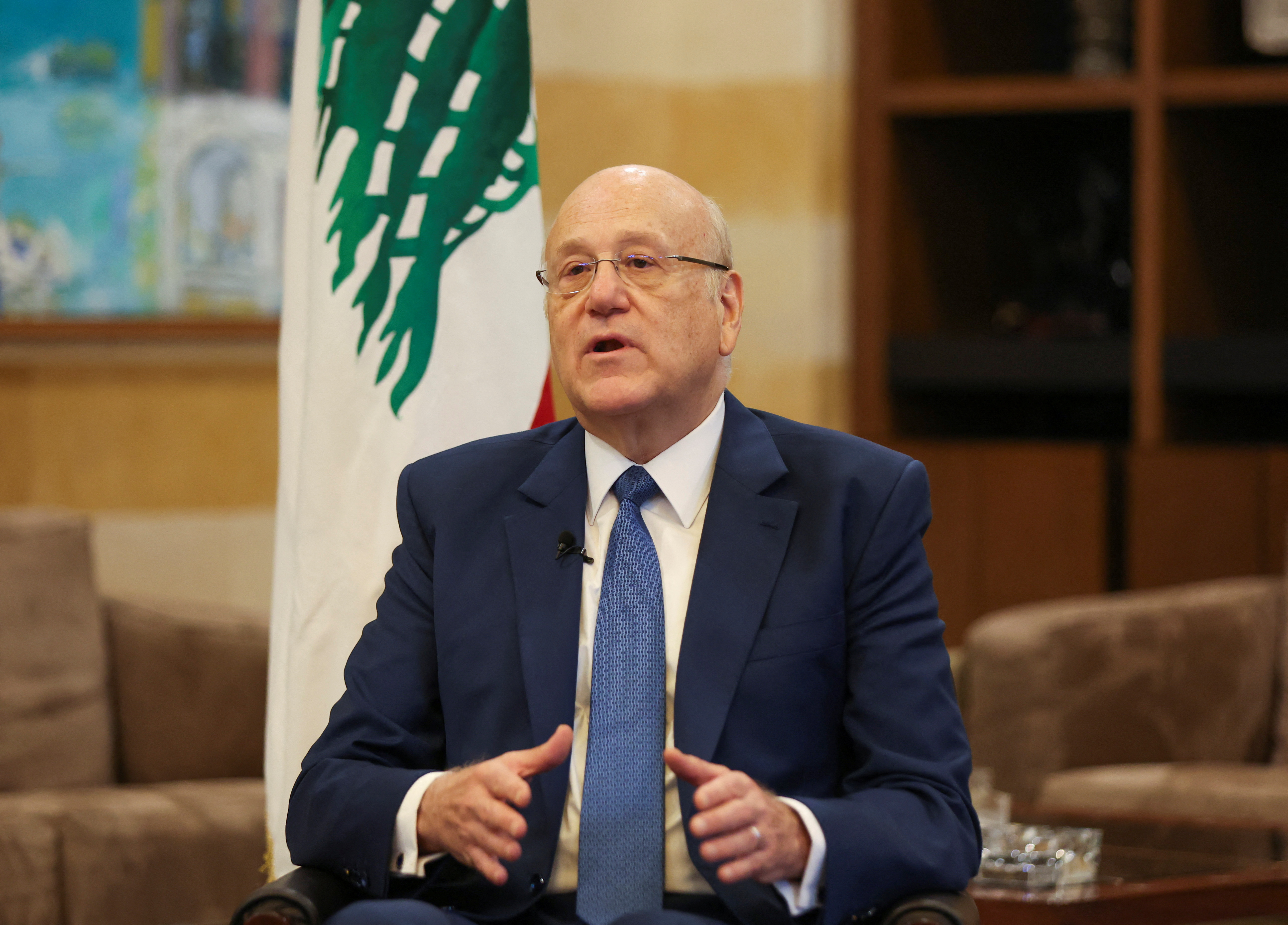 Lebanon's caretaker Prime Minister Najib Mikati gestures as he attends an interview with Reuters at the government headquarters in downtown Beirut