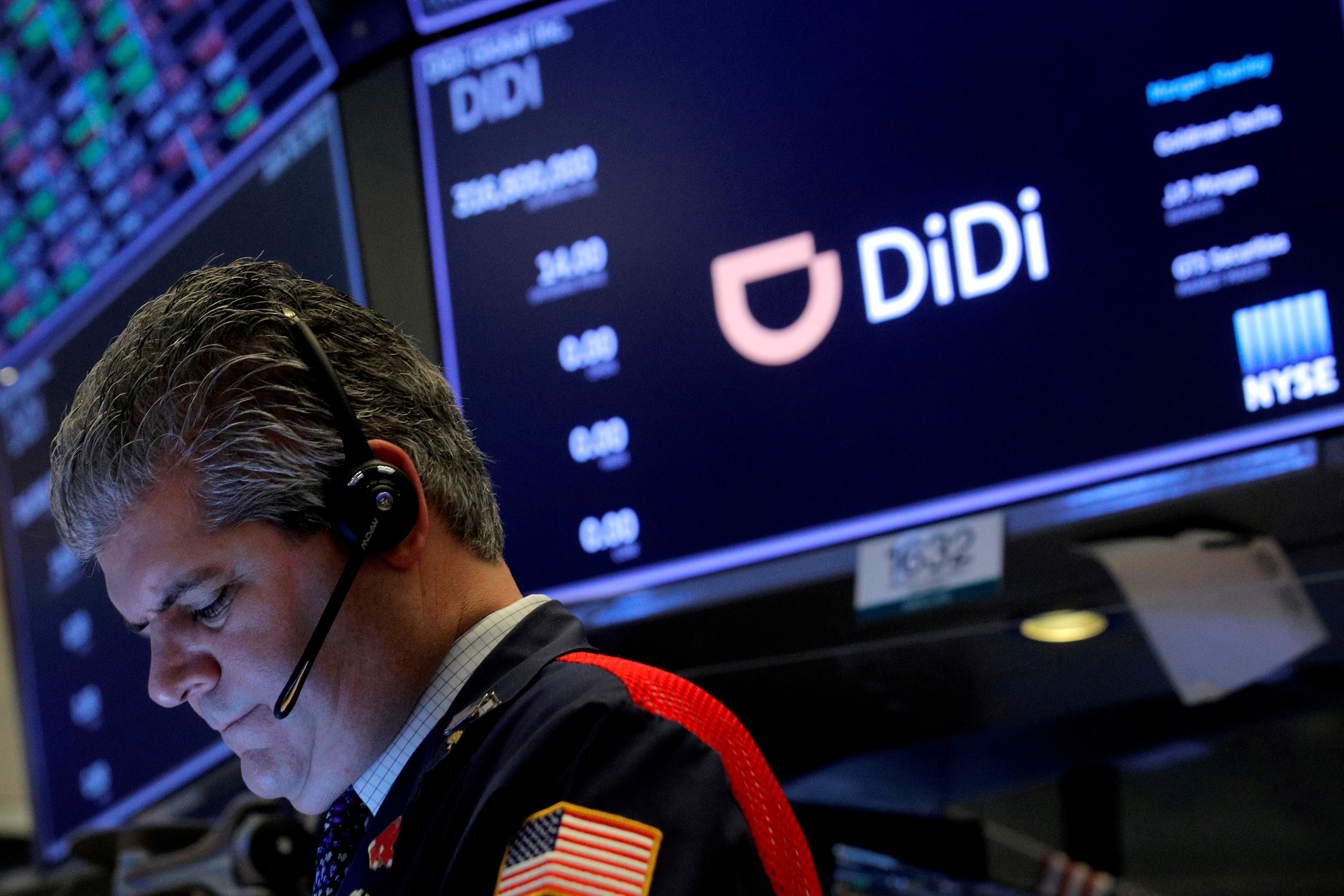 A trader works during the IPO for Chinese ride-hailing company Didi Global Inc on the New York Stock Exchange (NYSE) floor in New York City, U.S., June 30, 2021.  REUTERS/Brendan McDermid/File Photo