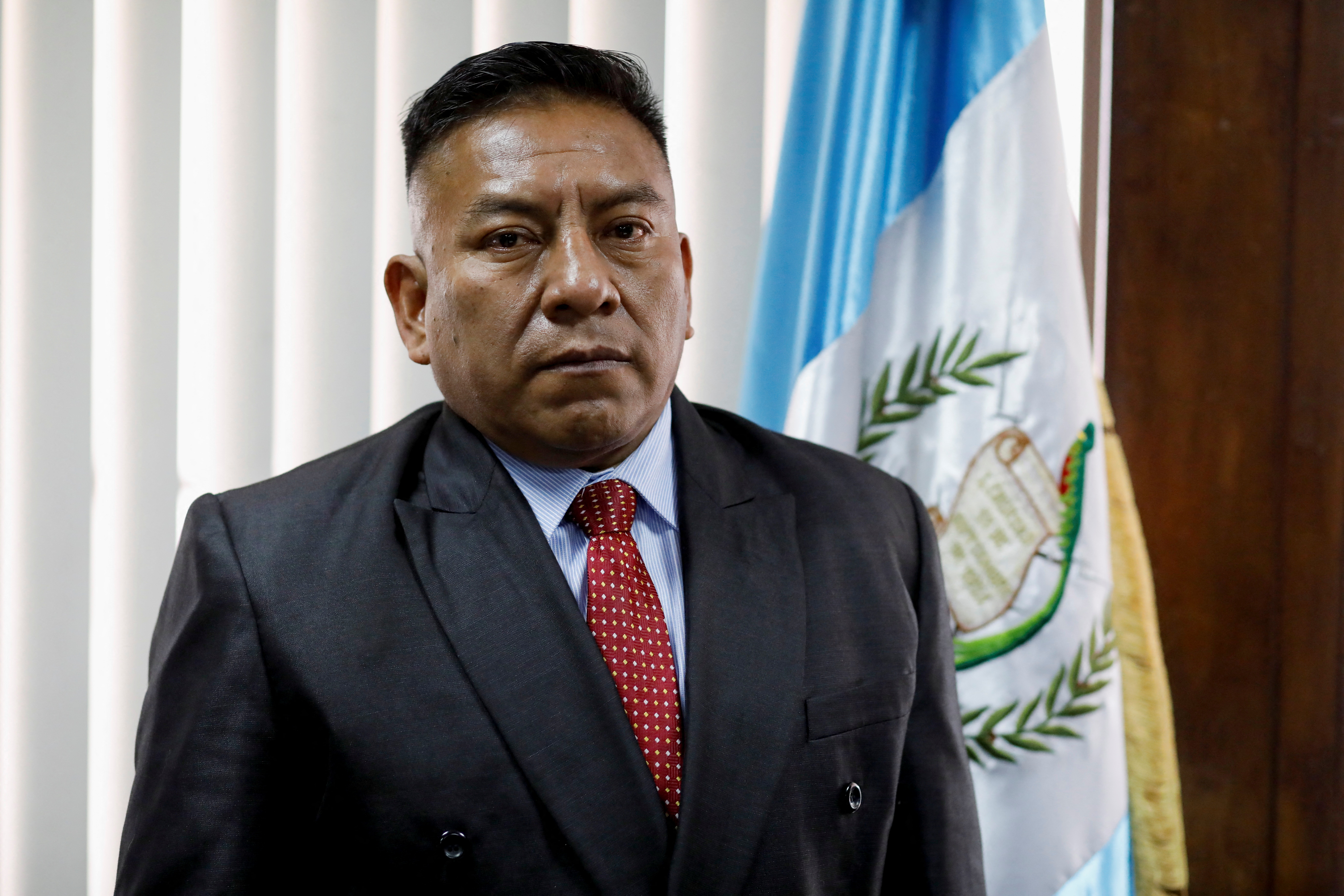 Judge Pablo Xitumul poses for a photo at his office in Guatemala City