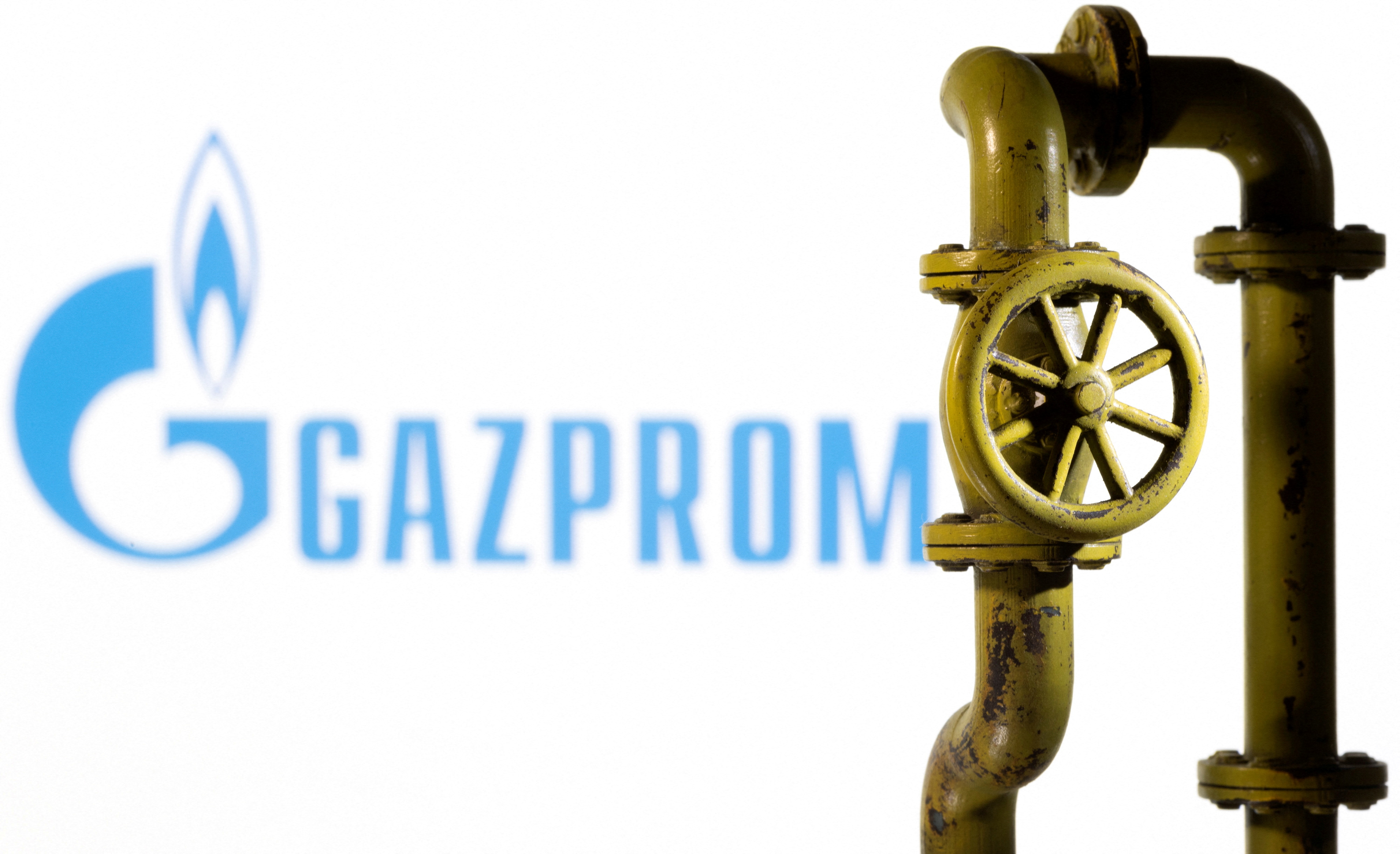 Illustration shows Gazprom logo and natural gas pipeline