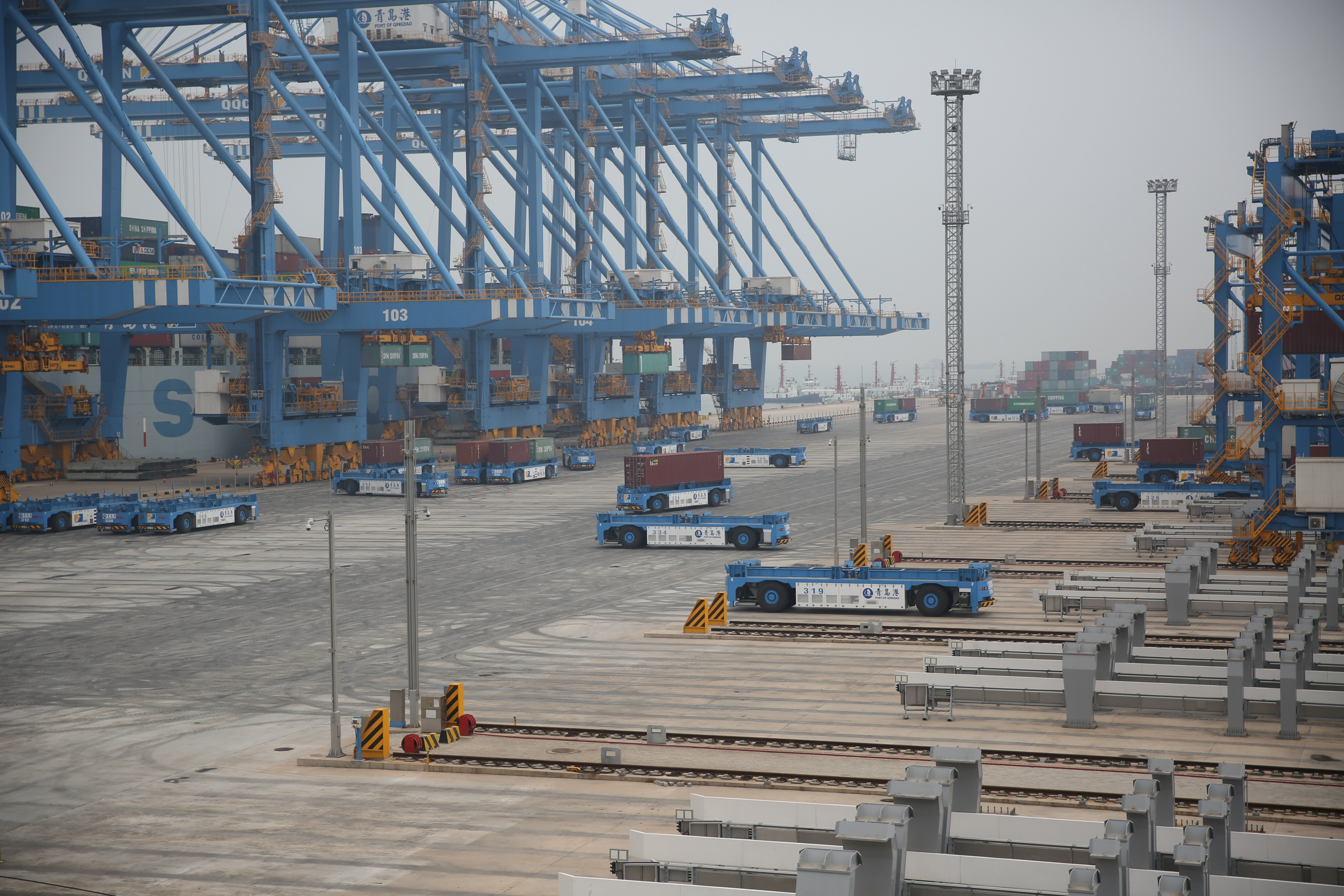 Automated guided vehicles (AGV) operate at an automated container terminal in Qingdao Port