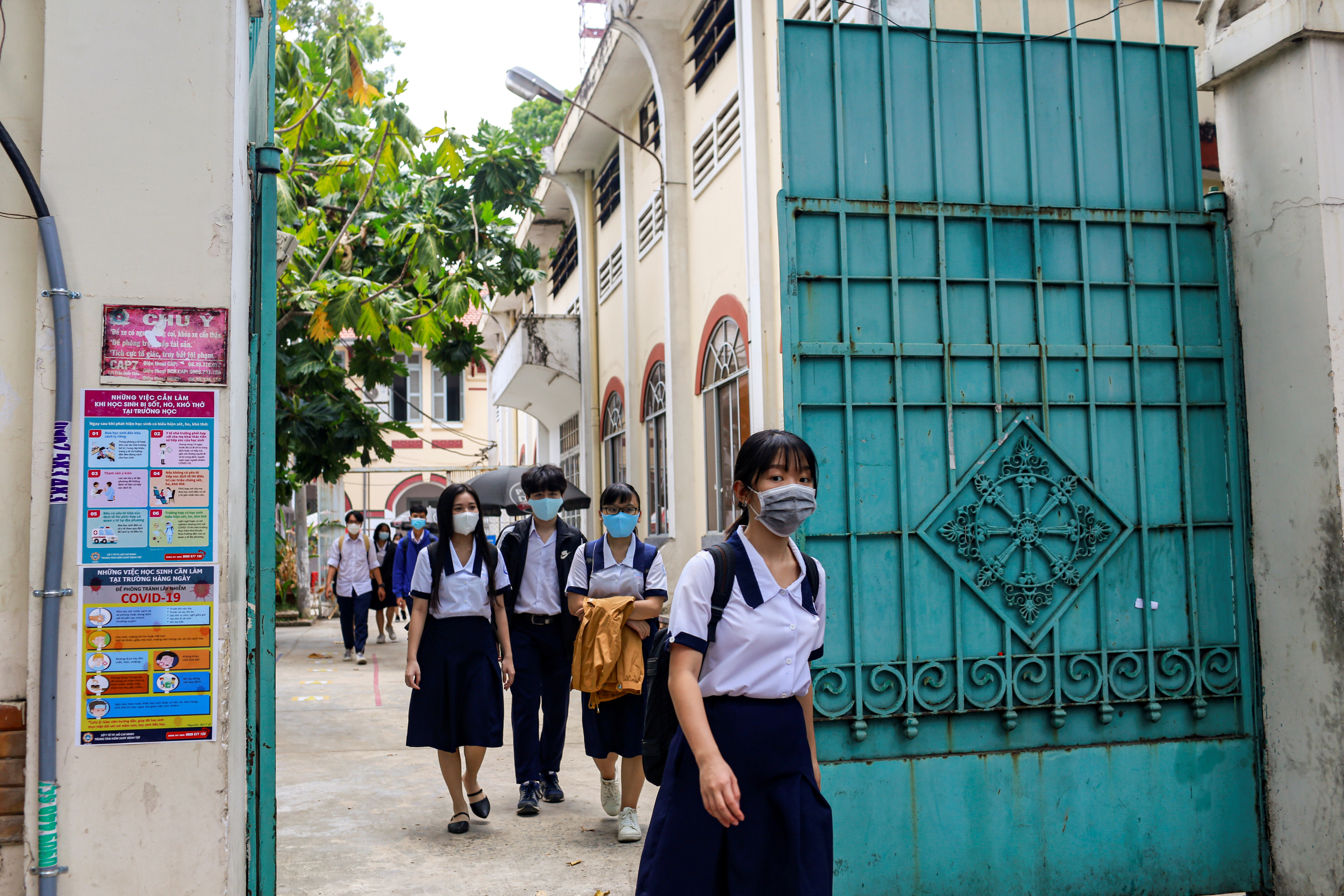 High school students leave their first day of class after the government eased nationwide lockdown during the coronavirus disease (COVID-19) outbreak in Ho Chi Minh, Vietnam May 5, 2020. REUTERS/Yen Duong