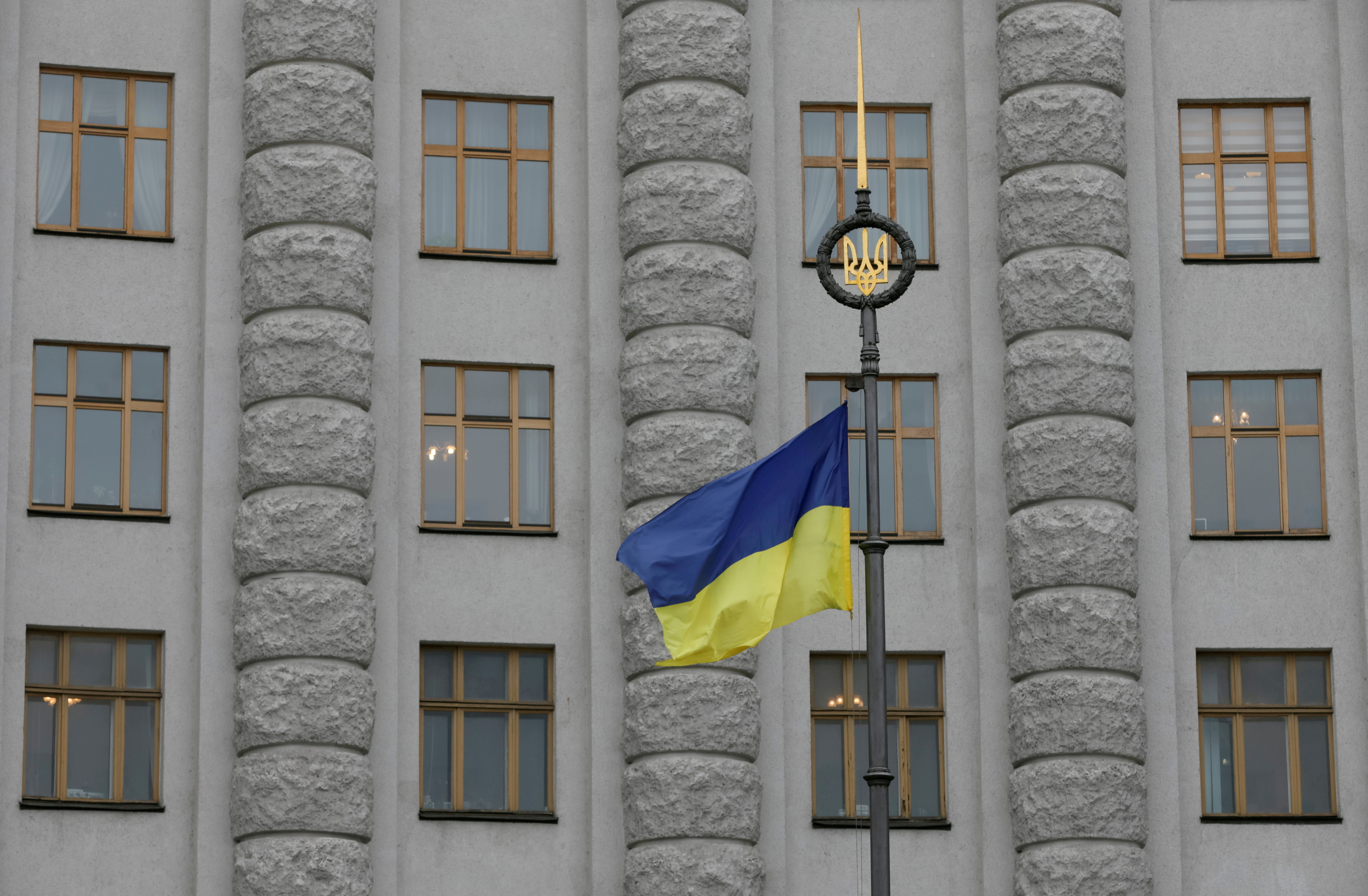 A Ukrainian national flag flies in front of government building in central Kiev