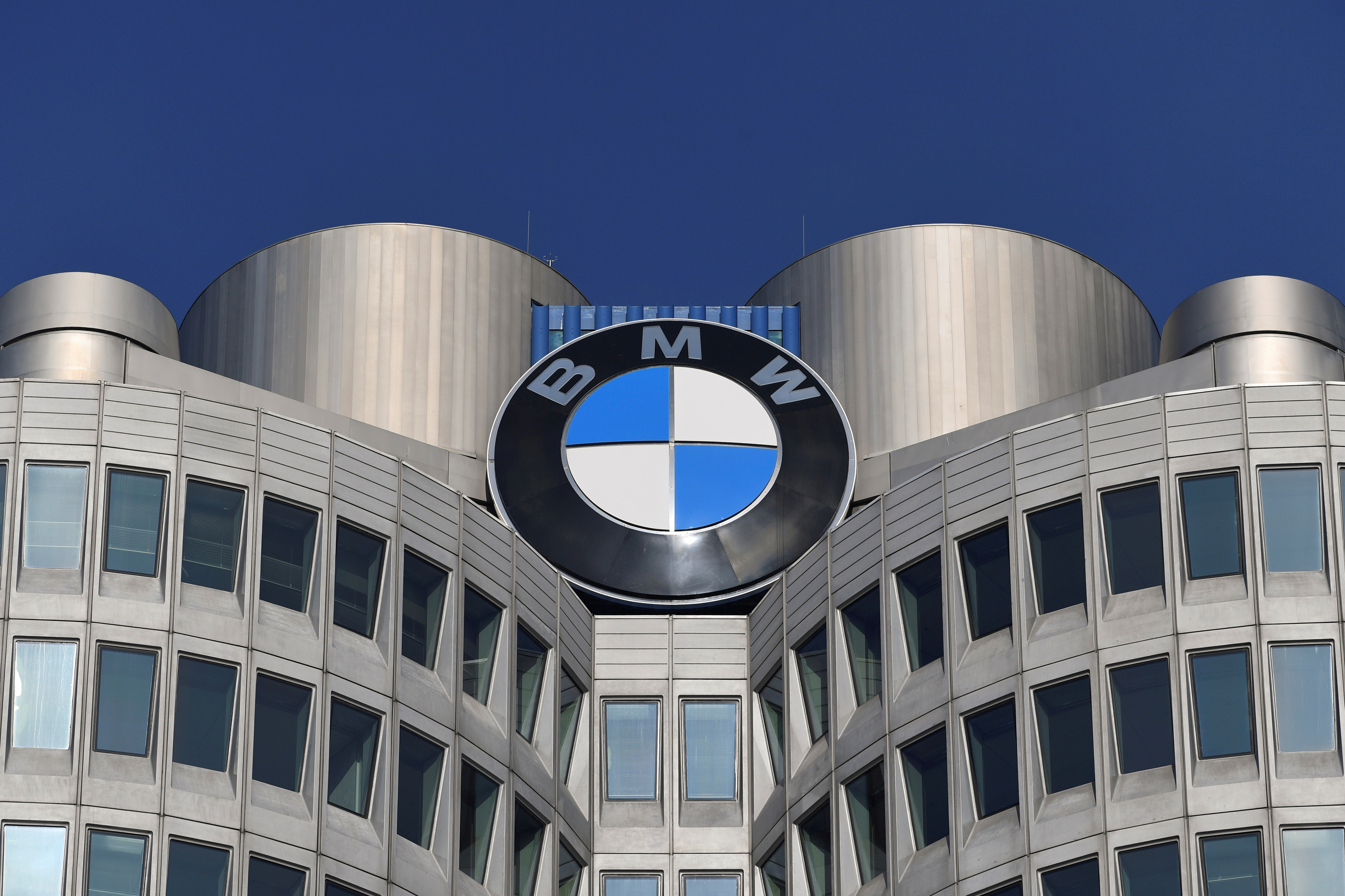 The logo of German car manufacturer BMW is seen on the company headquarters in Munich