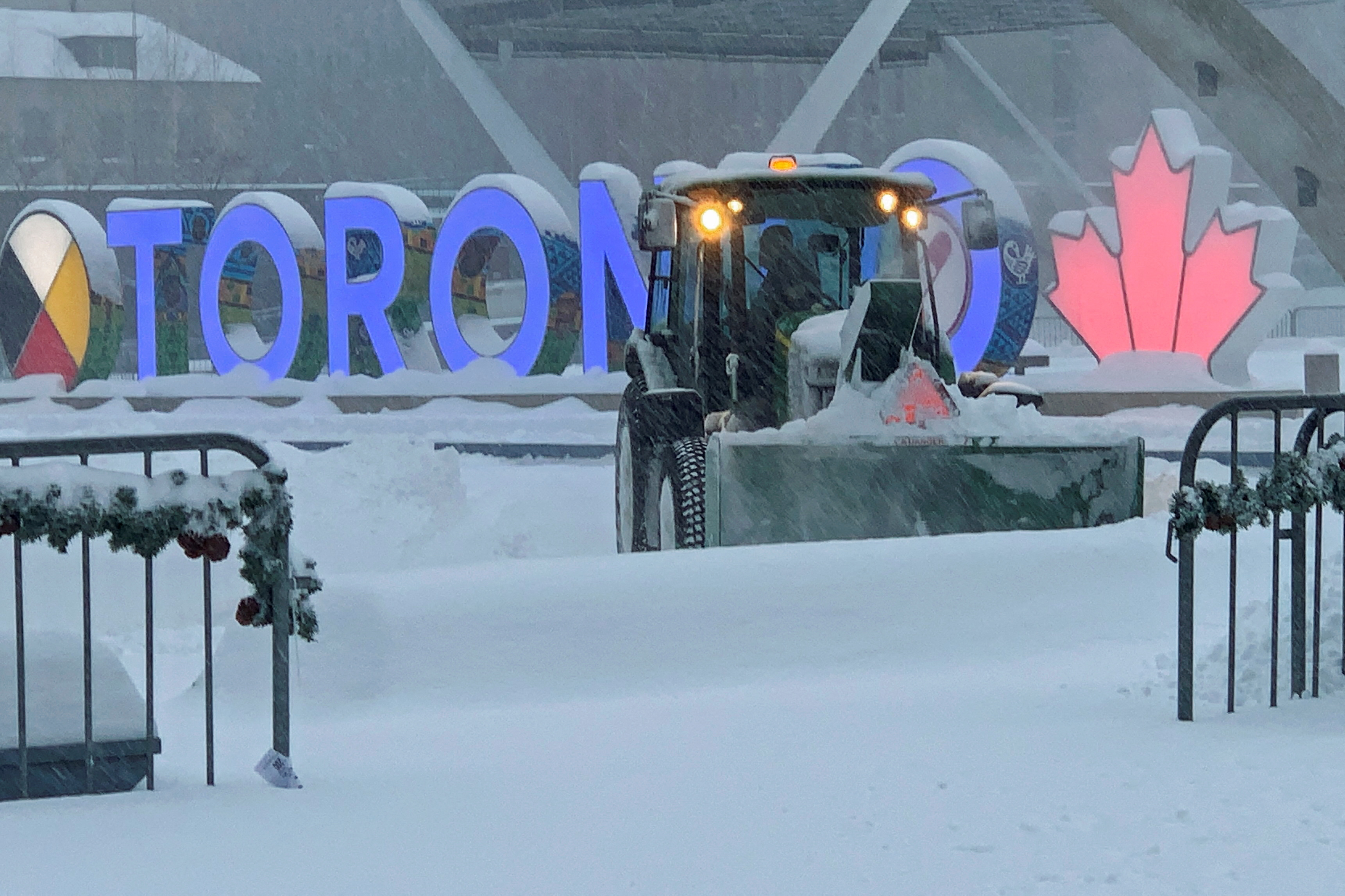 Snow plough clears Nathan Phillips Square in front of Toronto city hall
